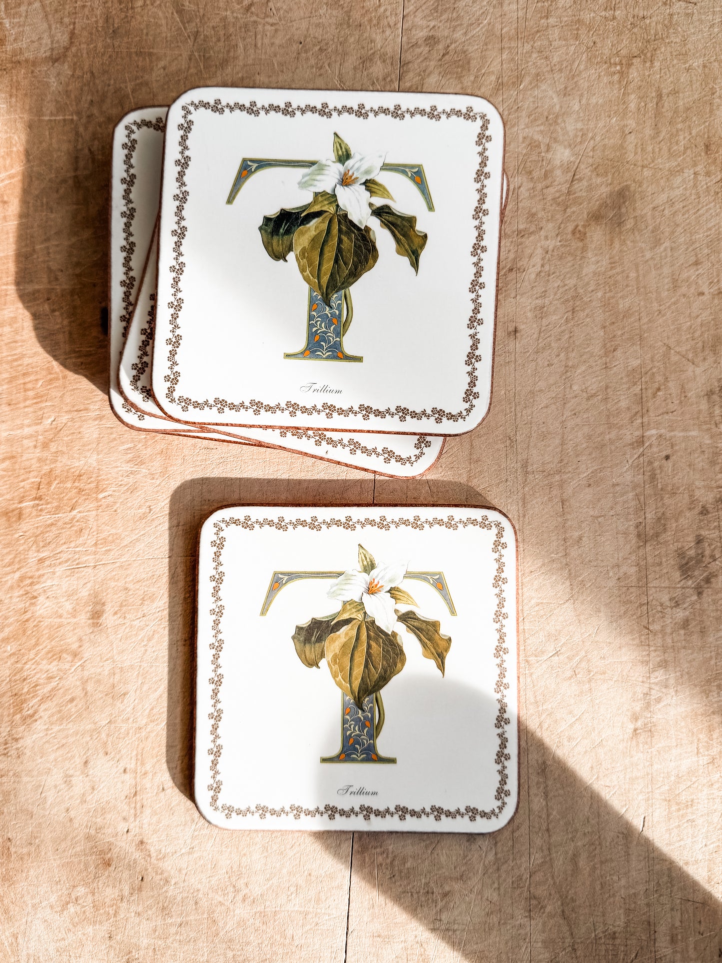 Vintage coasters with the letter T