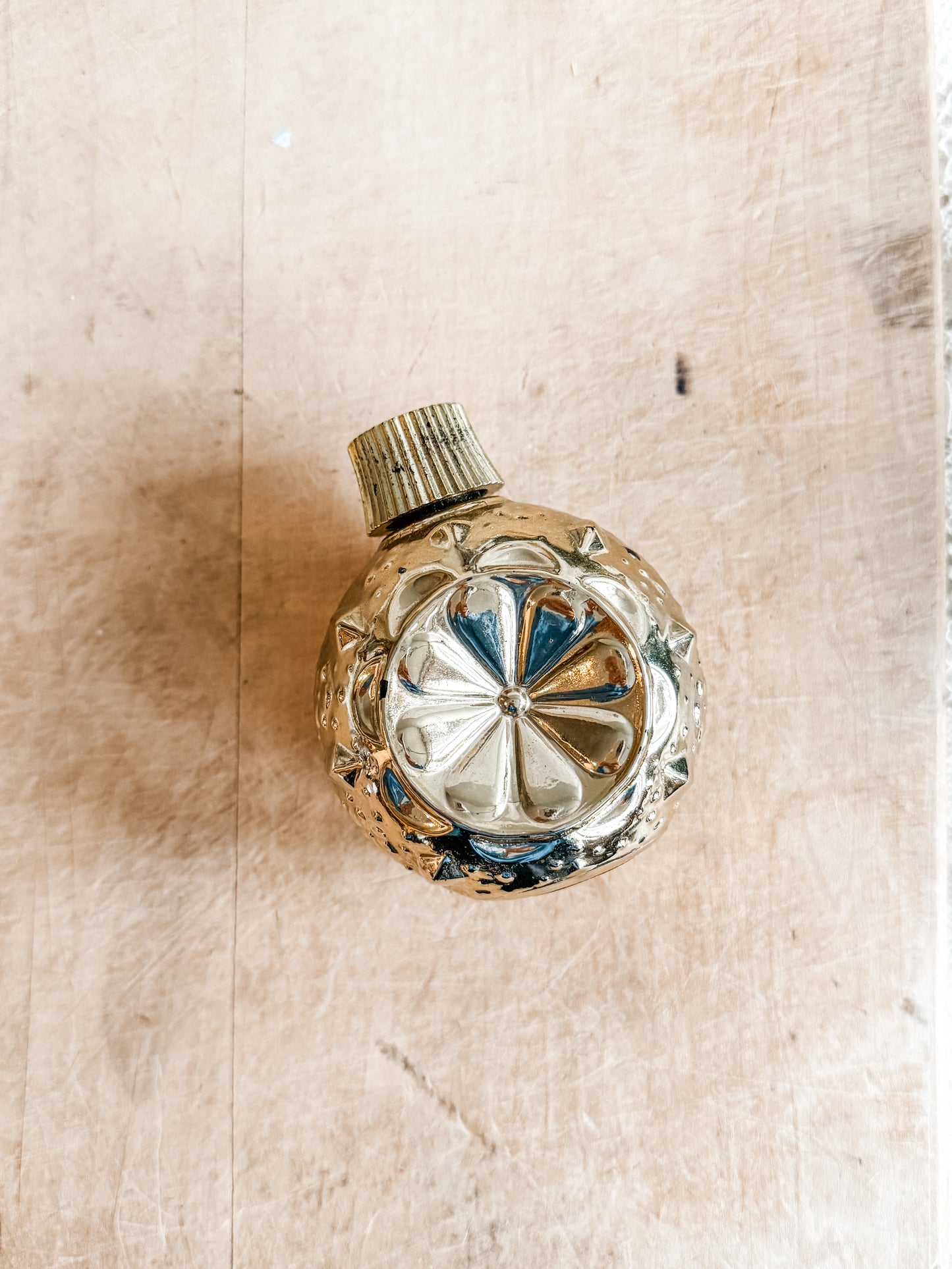 Gold Avon ornament decanter