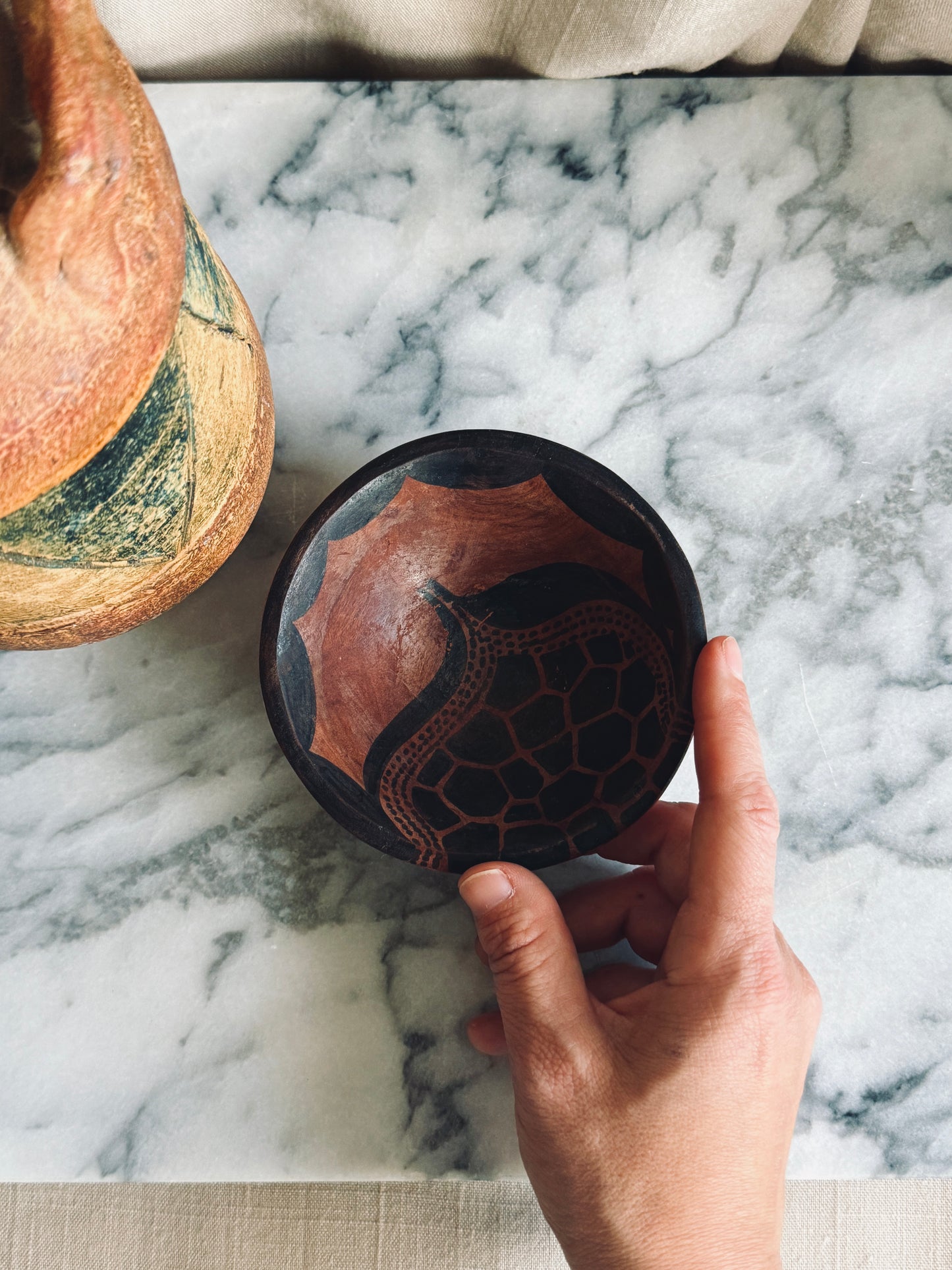 Wooden bowl with hand drawn motif