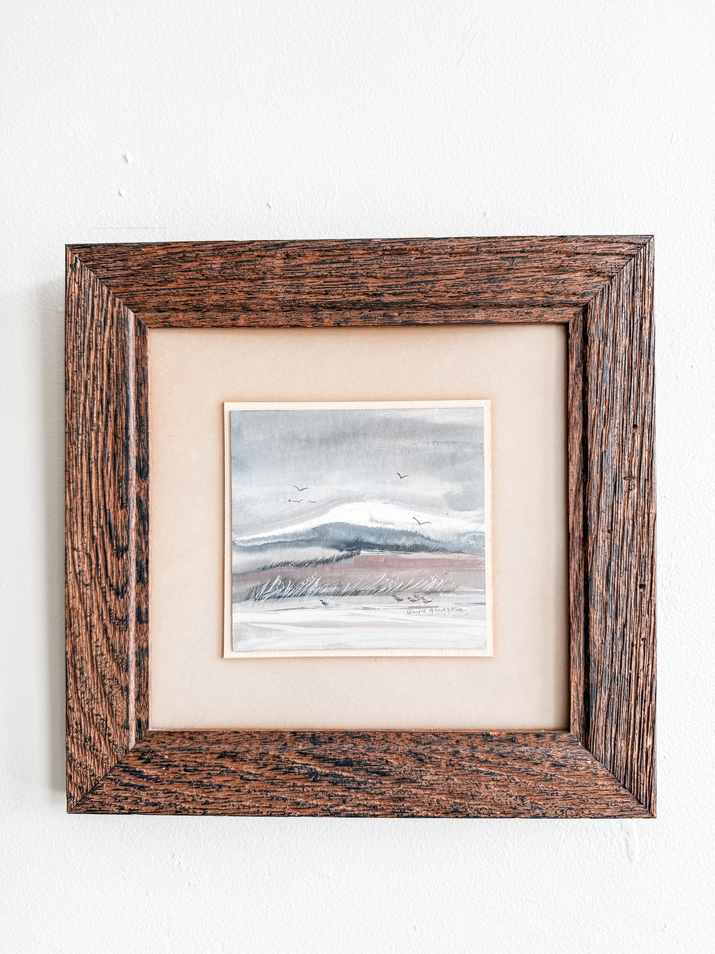 Original framed watercolor “Seaside birds and hills” scene signed Gayle Anderson