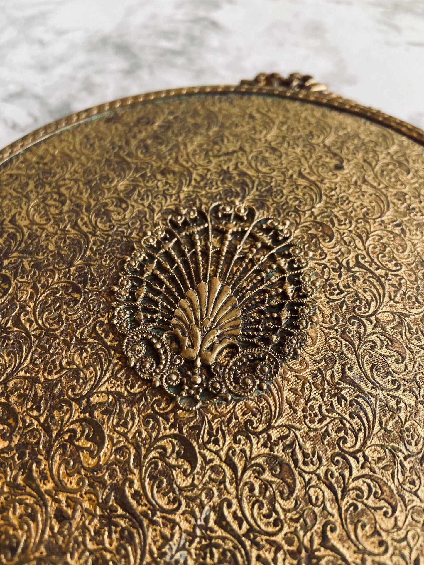 Beveled hand mirror with filigree shell detail