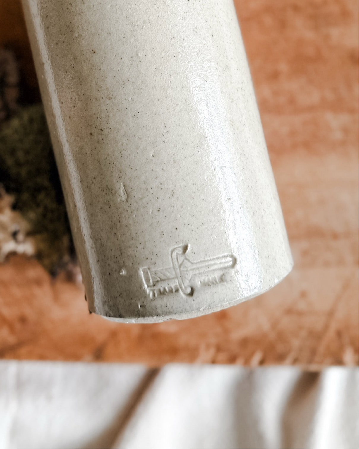 Creamy colored Stoneware Ink Pour Bottle, Early 1900’s, Marked with a rare sword logo