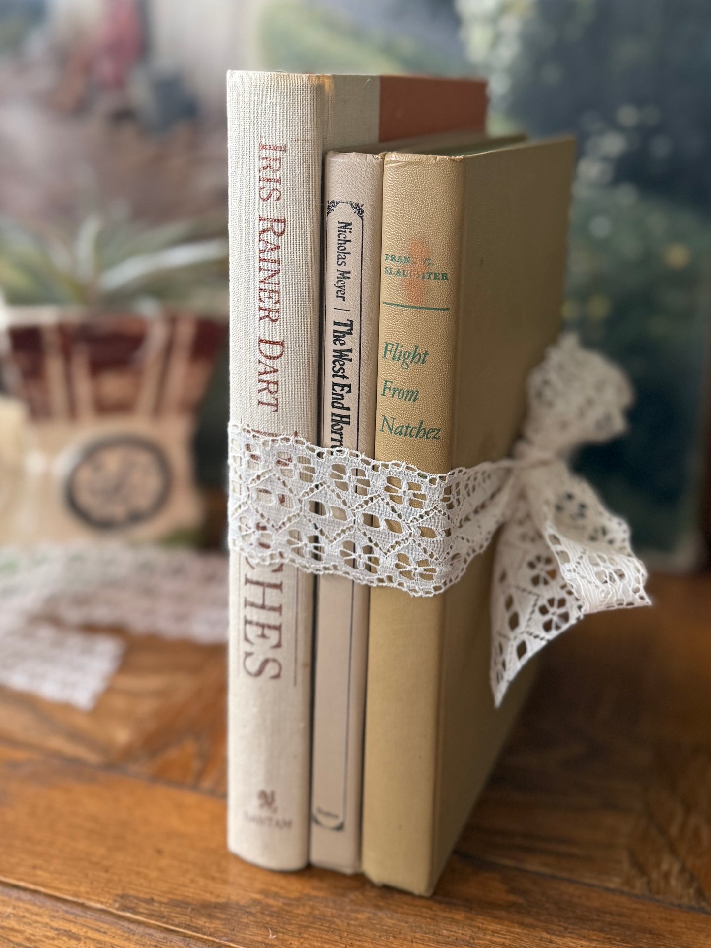 Neutral book stack tied with lace ribbon
