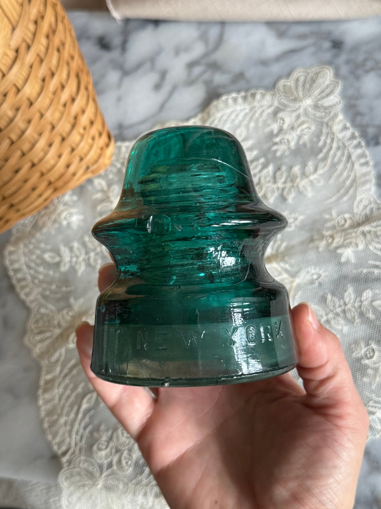 Teal colored glass insulator