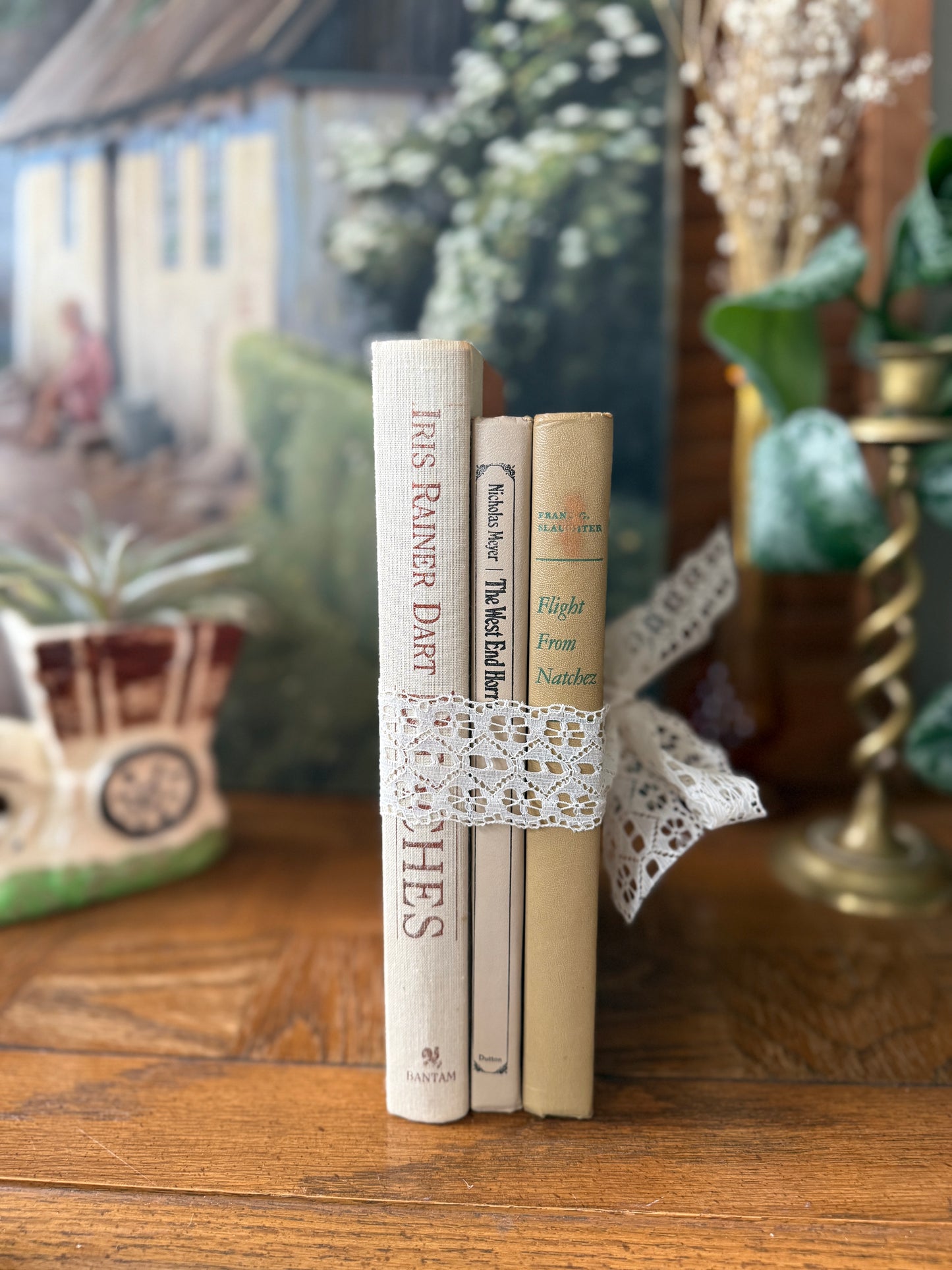 Neutral book stack tied with lace ribbon