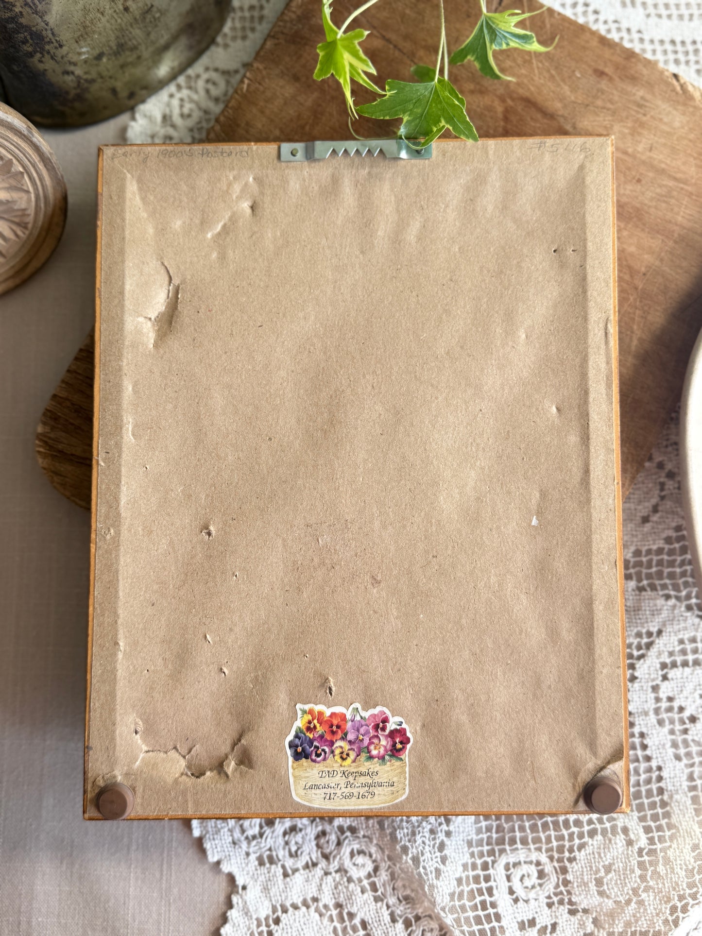 Framed antique postcard of puppies in the rain