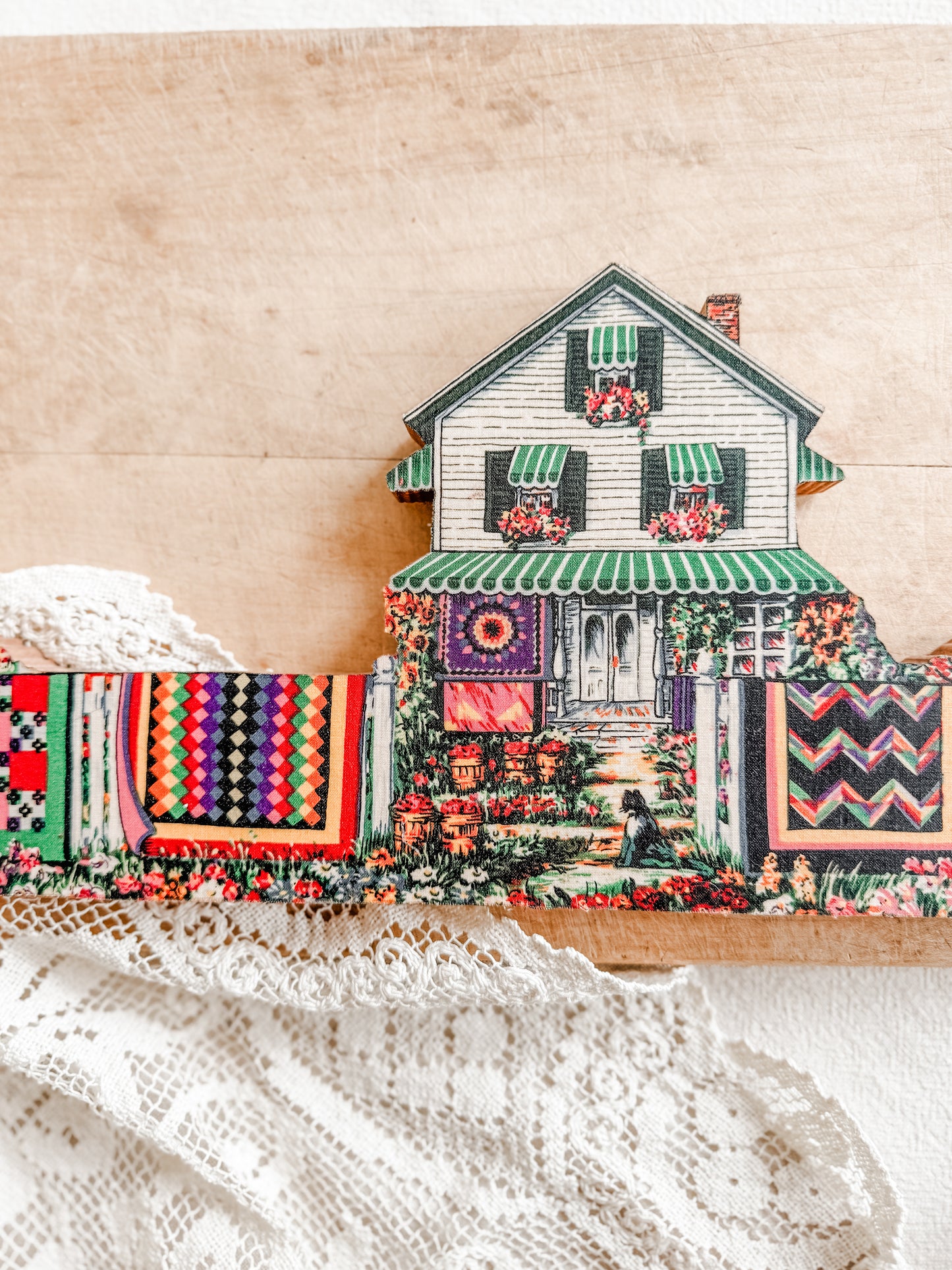 Wooden Farmhouse with hanging quilts on the line