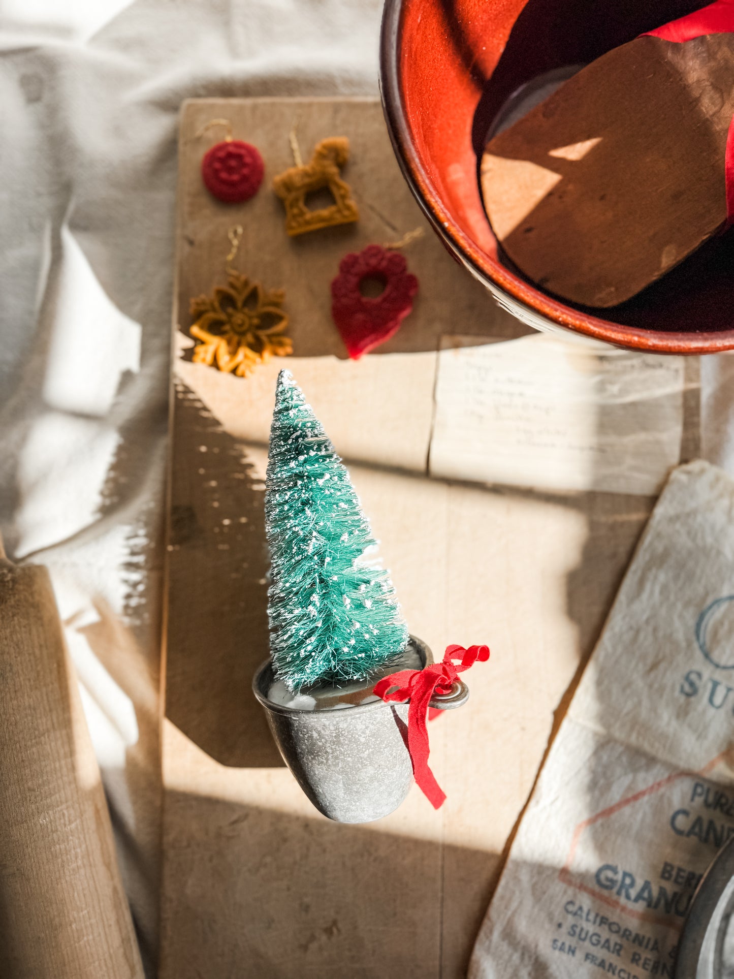 Bottle Brush tree in vintage measuring cup