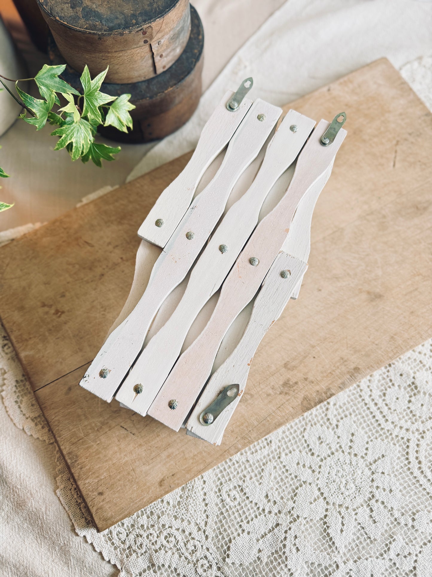 White accordion peg rack