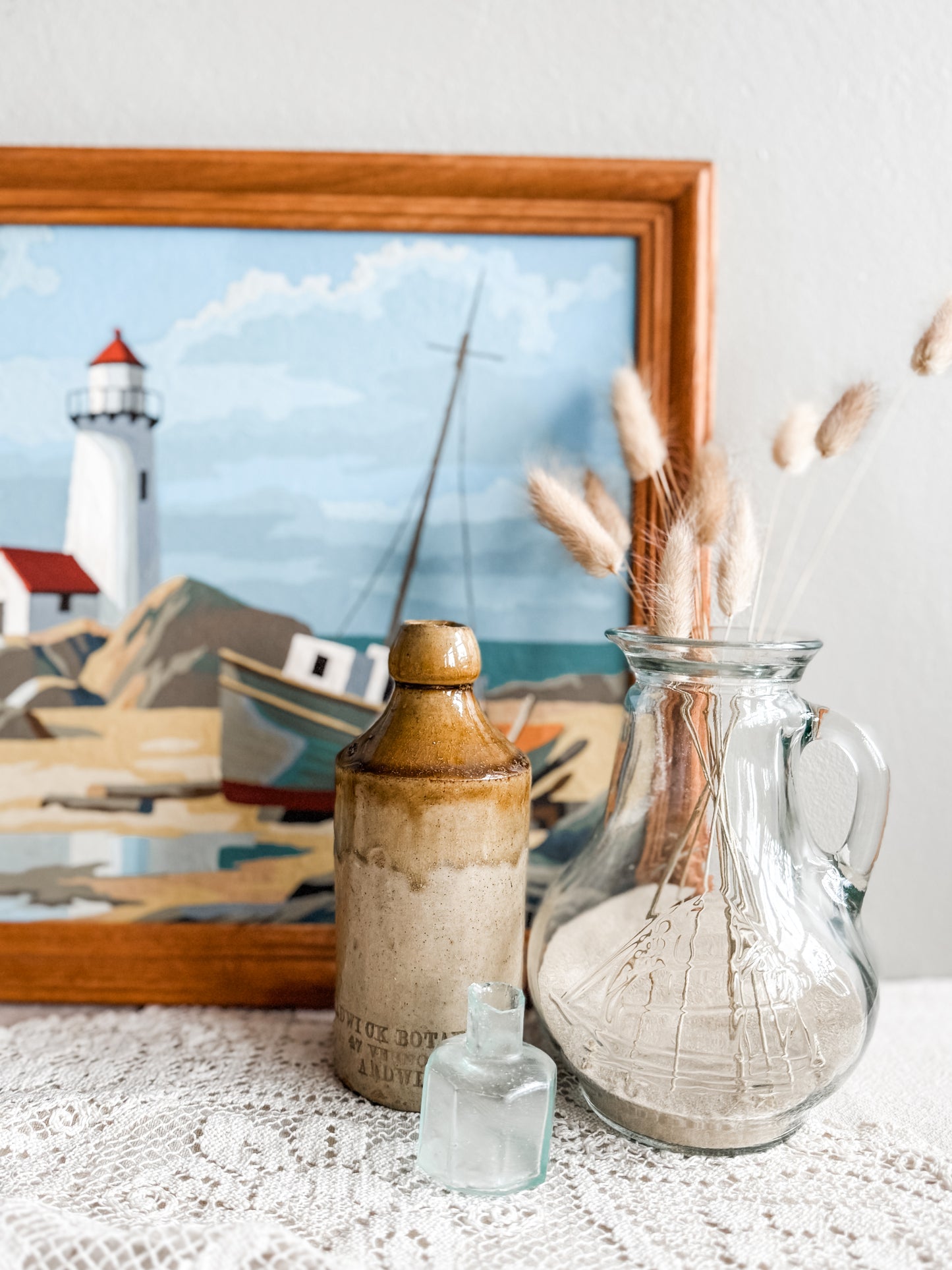 Glass pitcher with embossed sailing ship