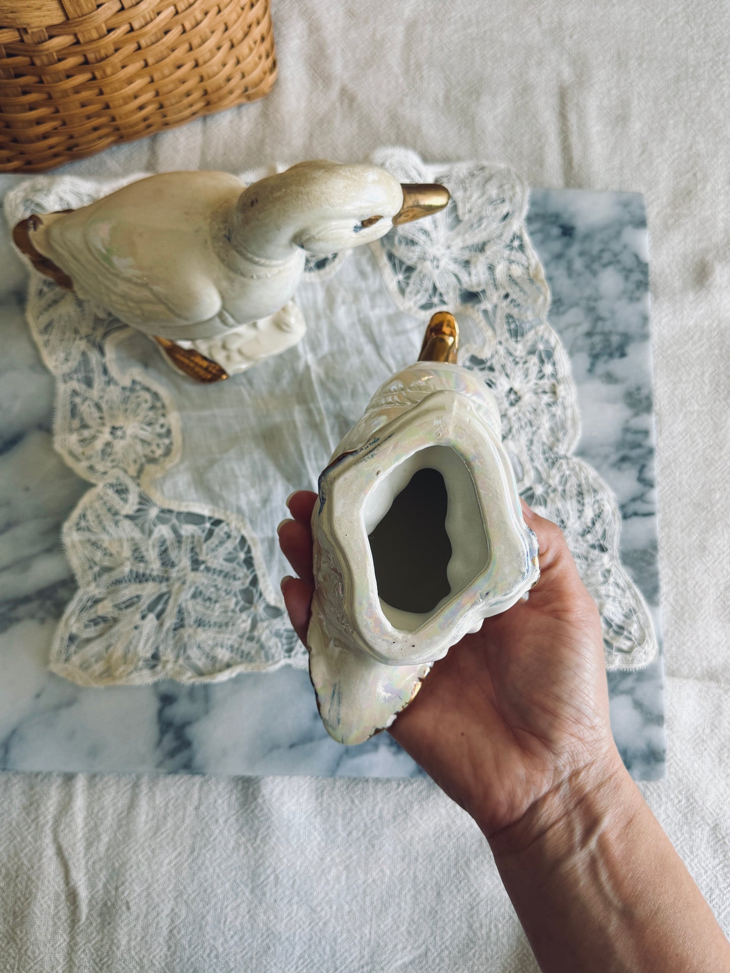 Pair of white and gold porcelain ducks