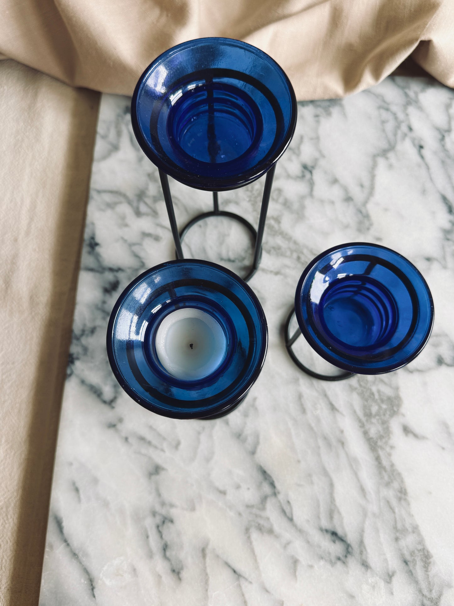 Metal and cobalt blue glass tealight holders