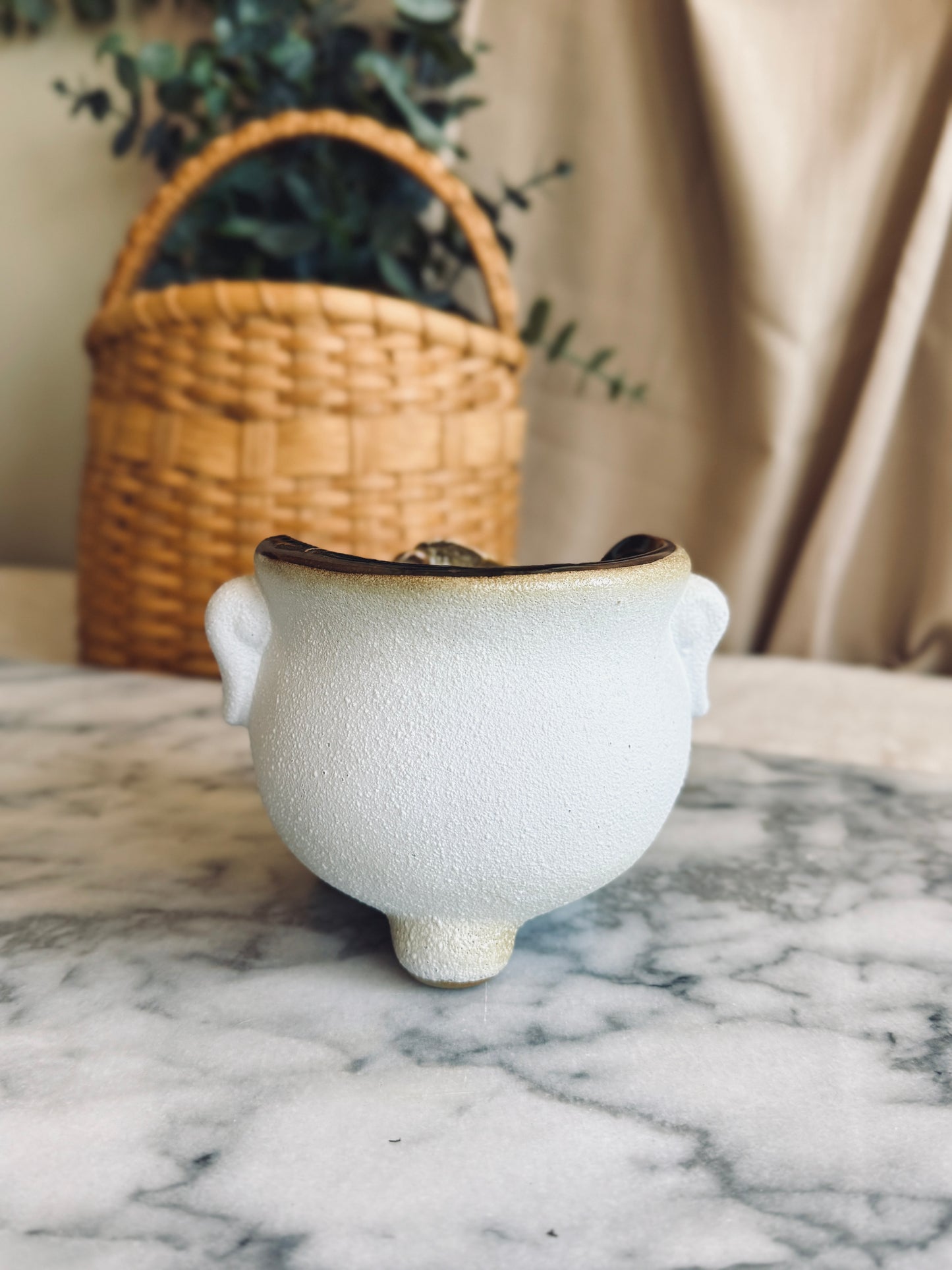 Footed planter with white rose