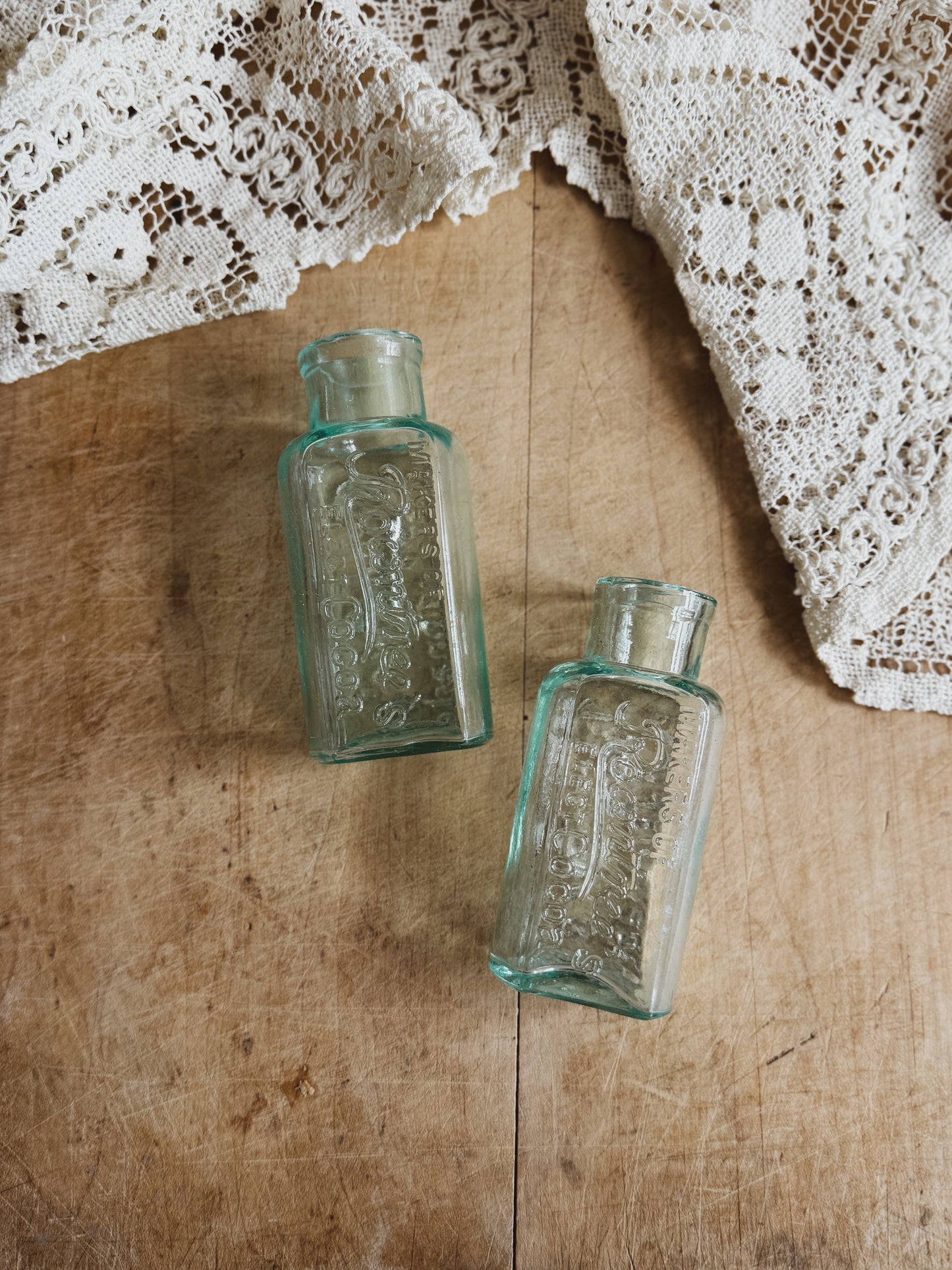 Antique aqua glass Rownstree bottles