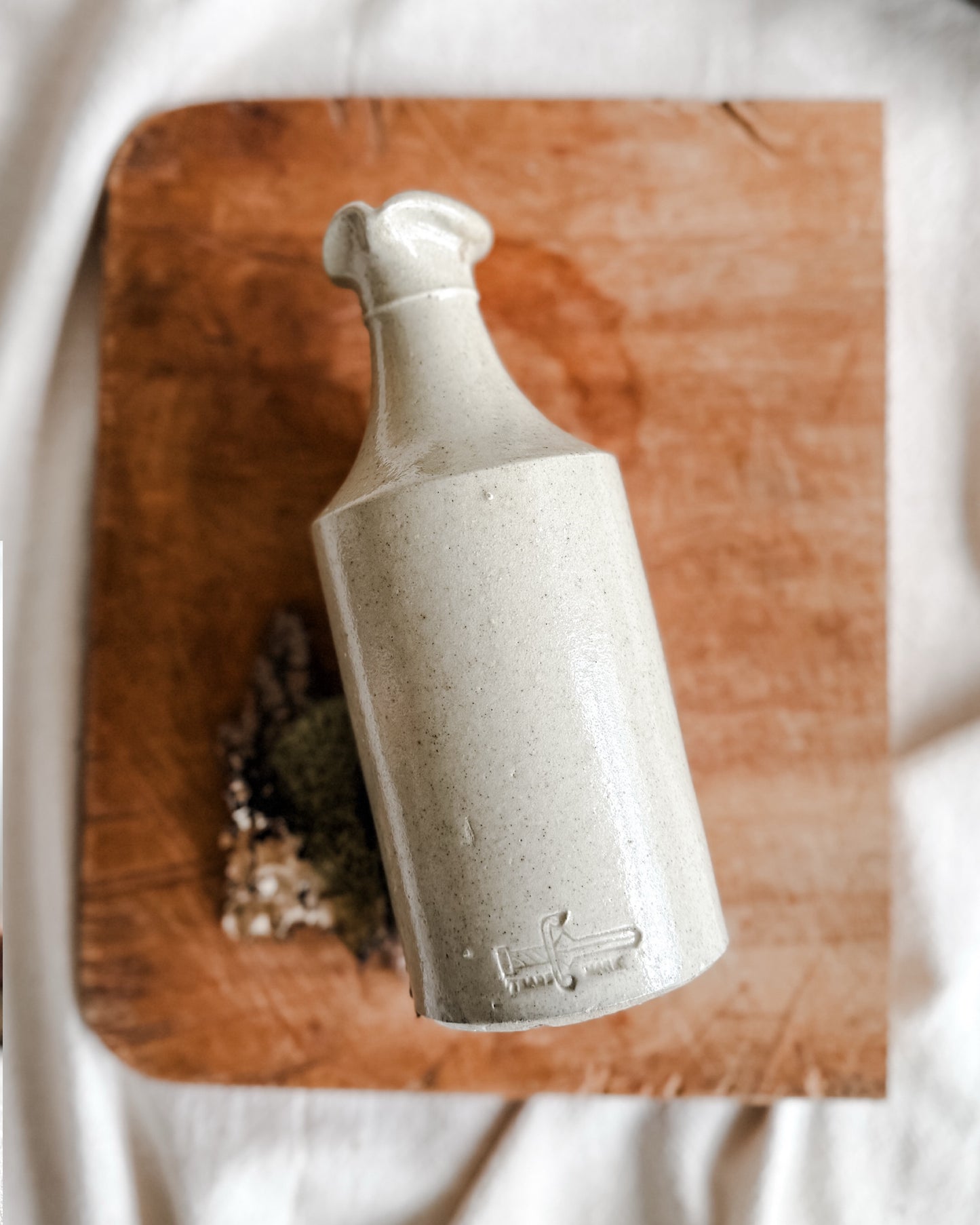 Creamy colored Stoneware Ink Pour Bottle, Early 1900’s, Marked with a rare sword logo