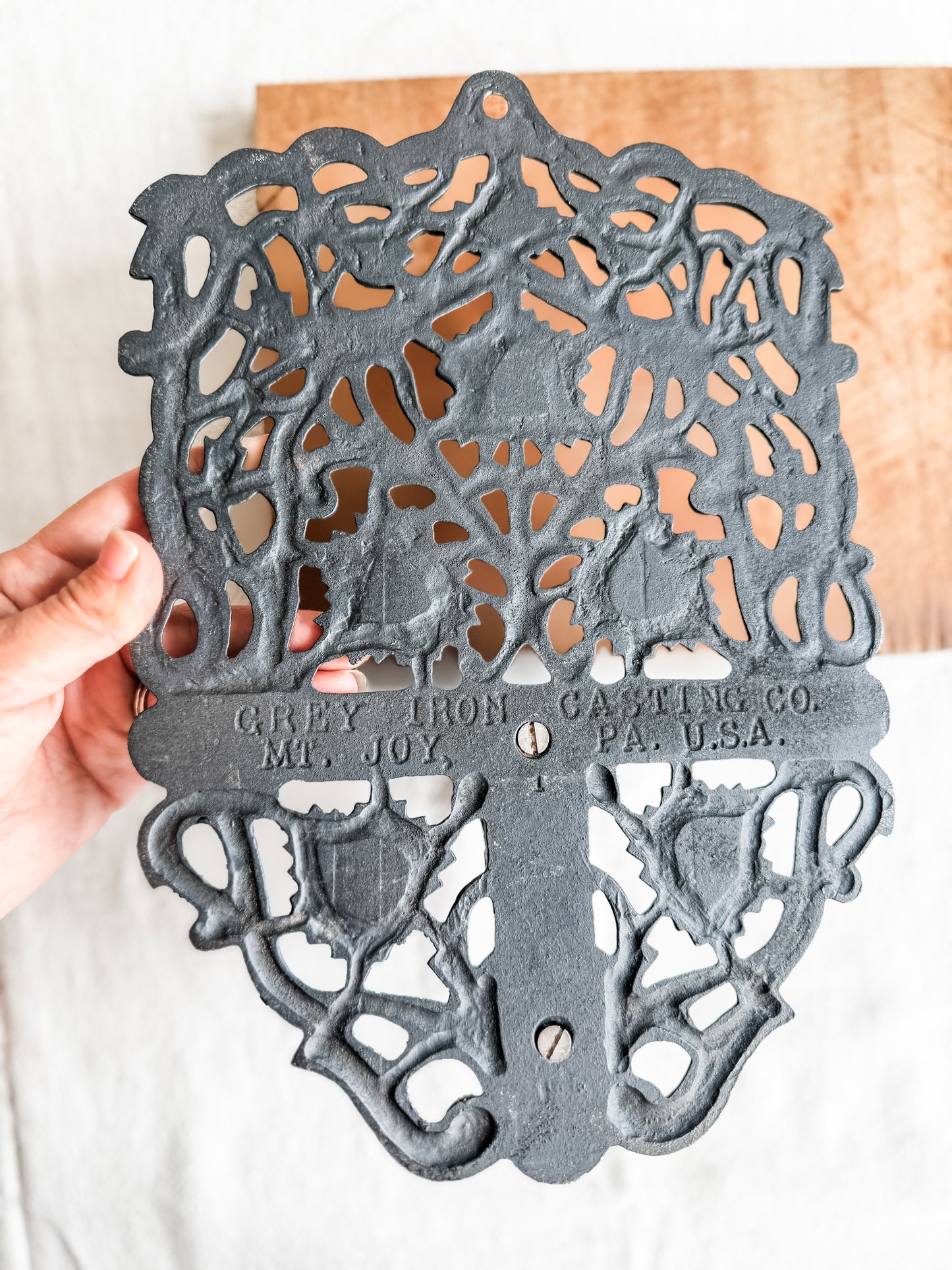 Cast iron wall shelf with leaf motif