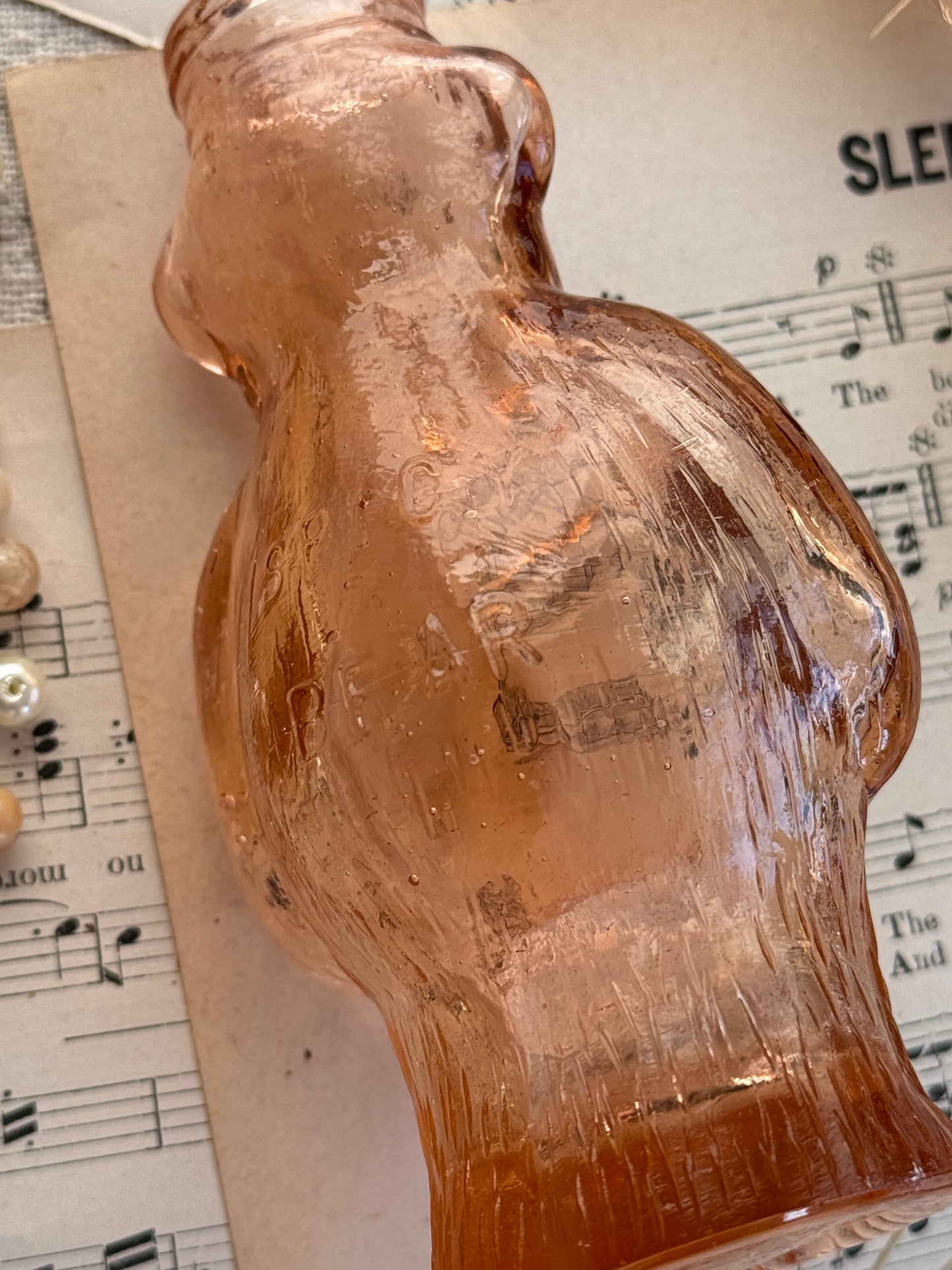 Pink glass bottle in the shape of a bear
