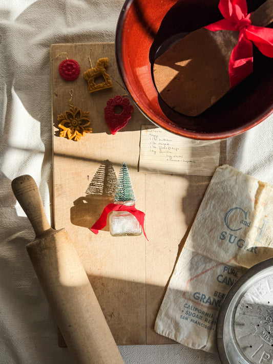 Bottle brush tree in antique glass inkwell
