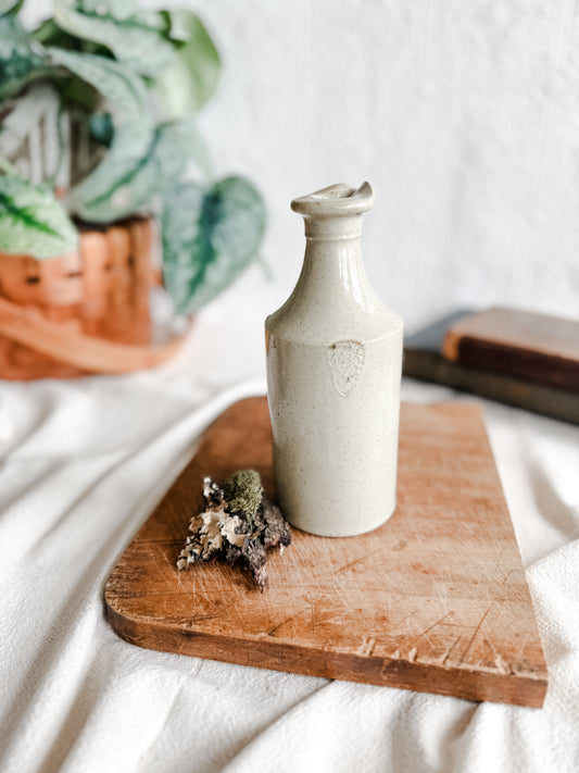 Creamy colored Stoneware Ink Pour Bottle, Early 1900’s, Marked with a rare sword logo
