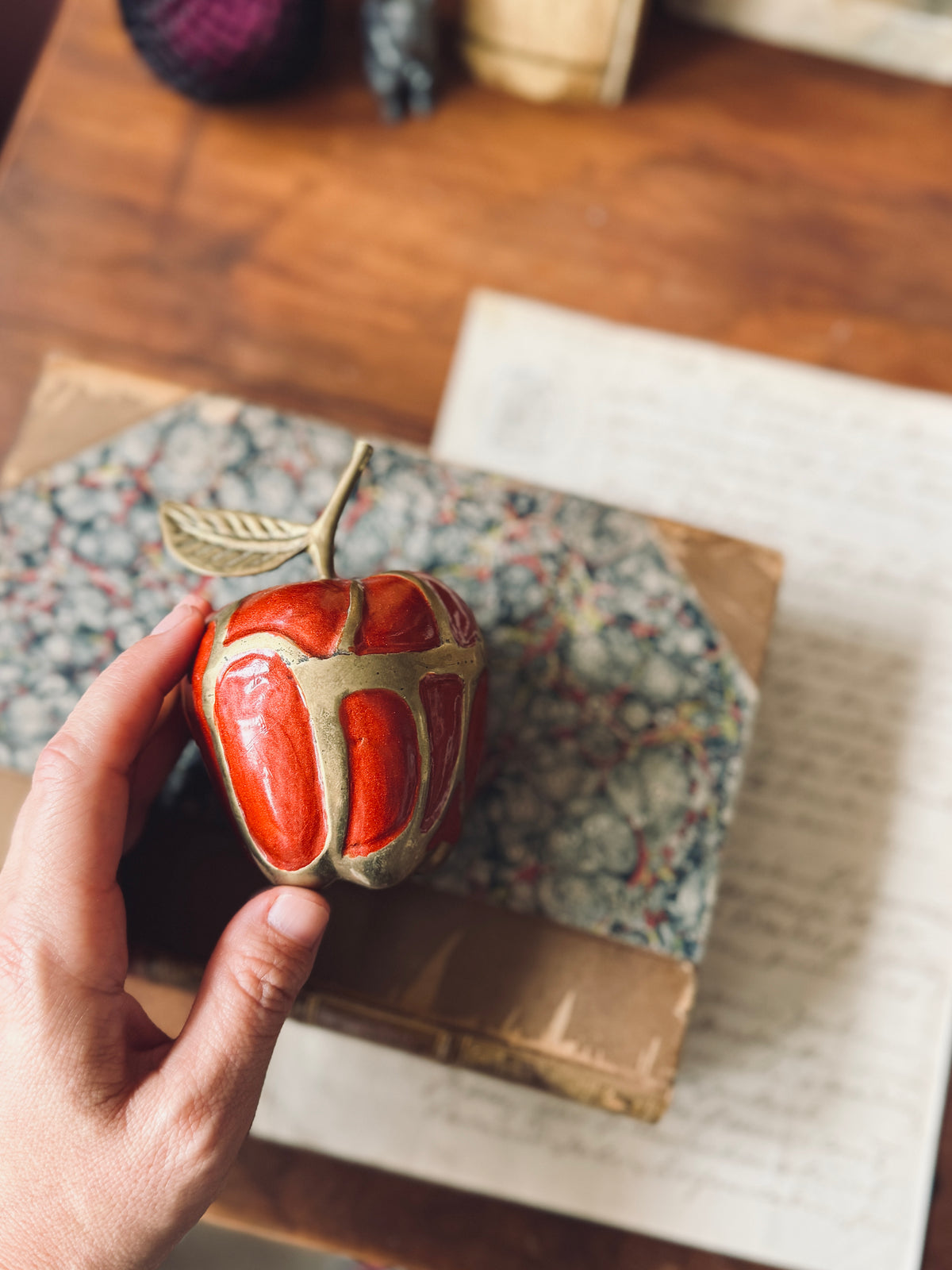 Brass and red enamel apple