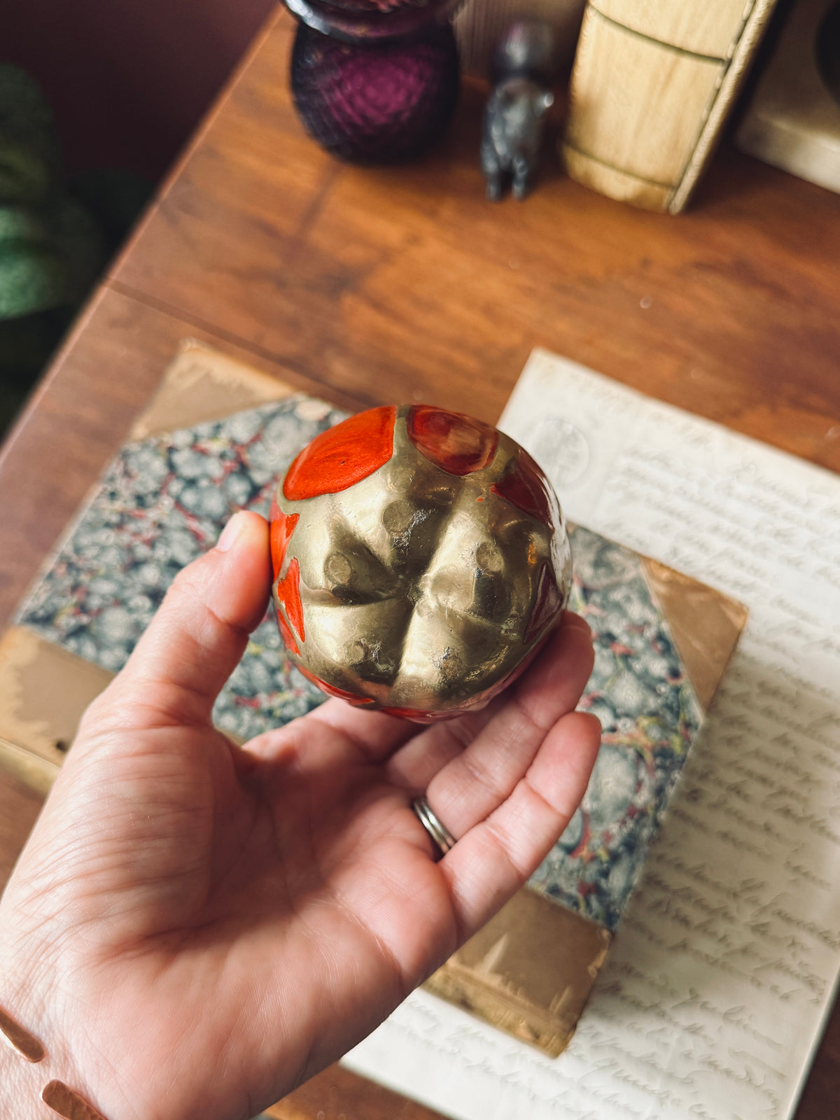 Brass and red enamel apple