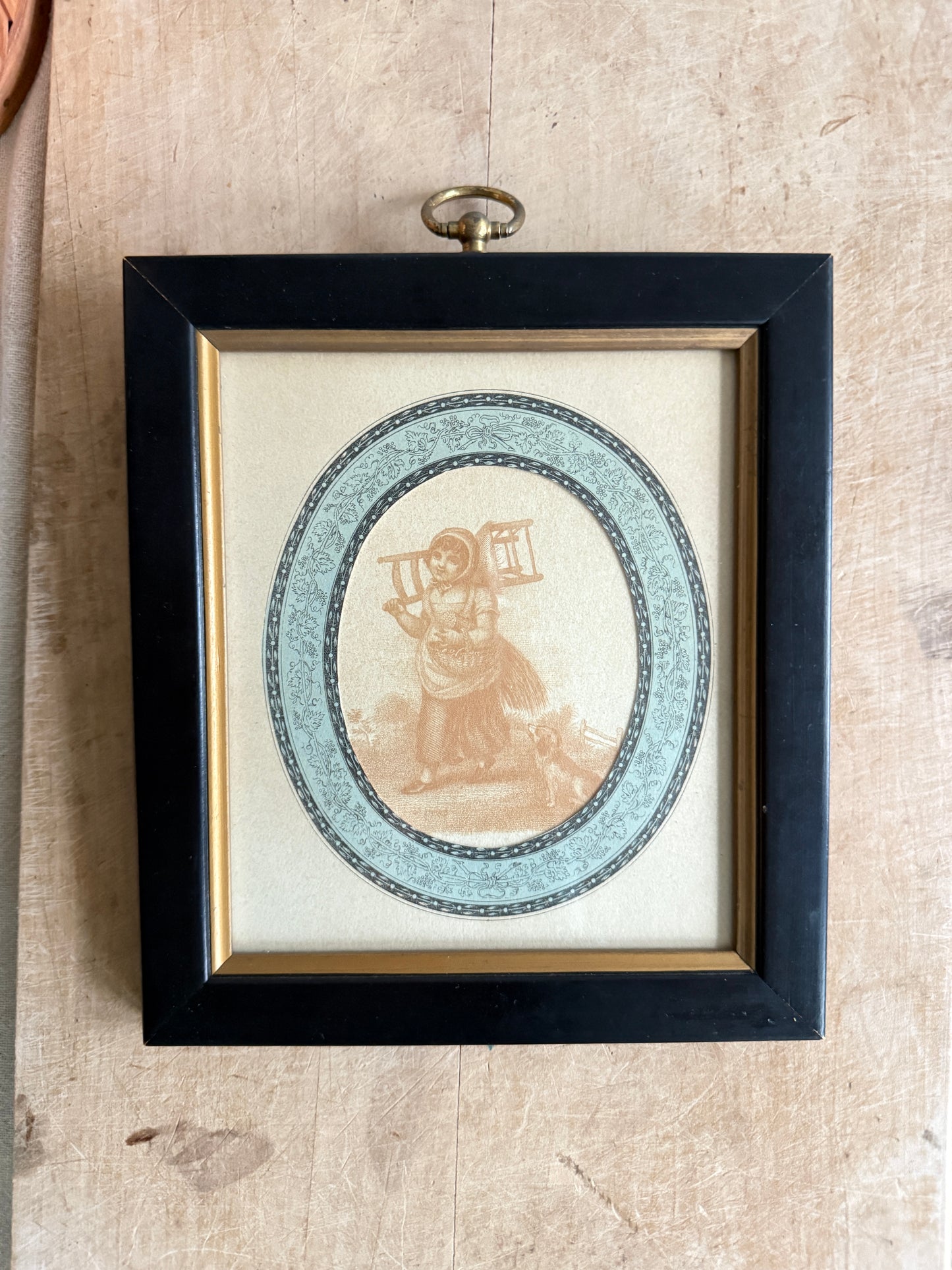 Framed antique art print of a girl and her dog