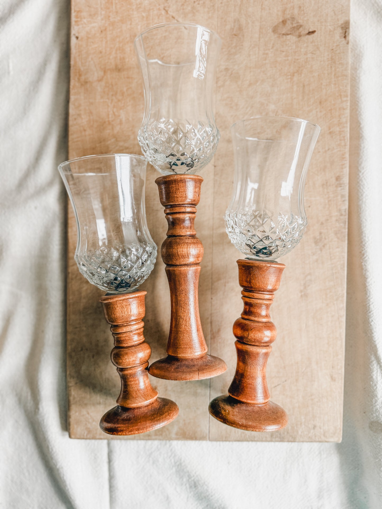 Three Wooden Candlesticks with Glass Votives Holders