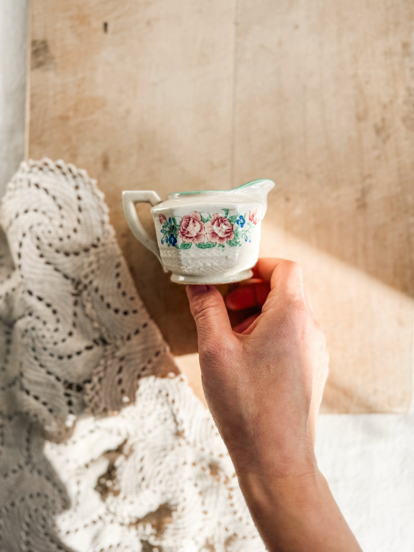 Small floral pitcher with green border