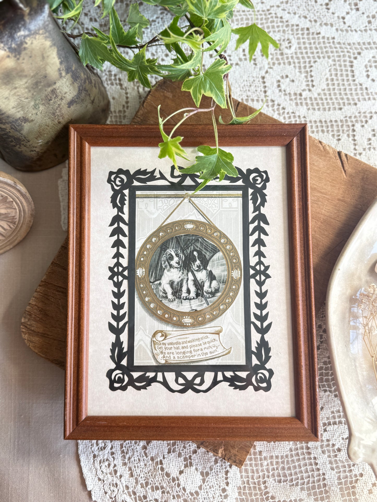 Framed antique postcard of puppies in the rain