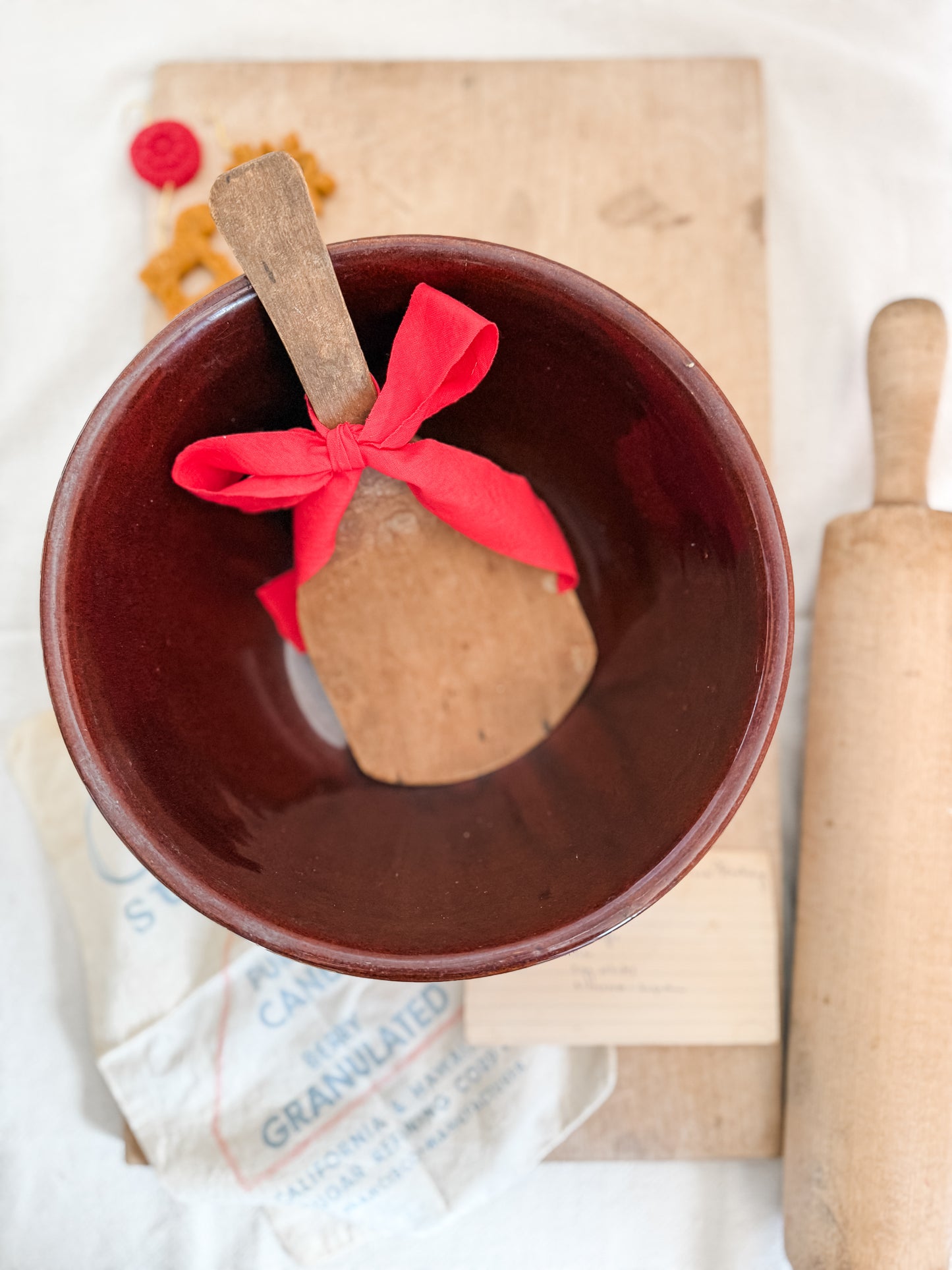 Primitive butter paddle with ribbon