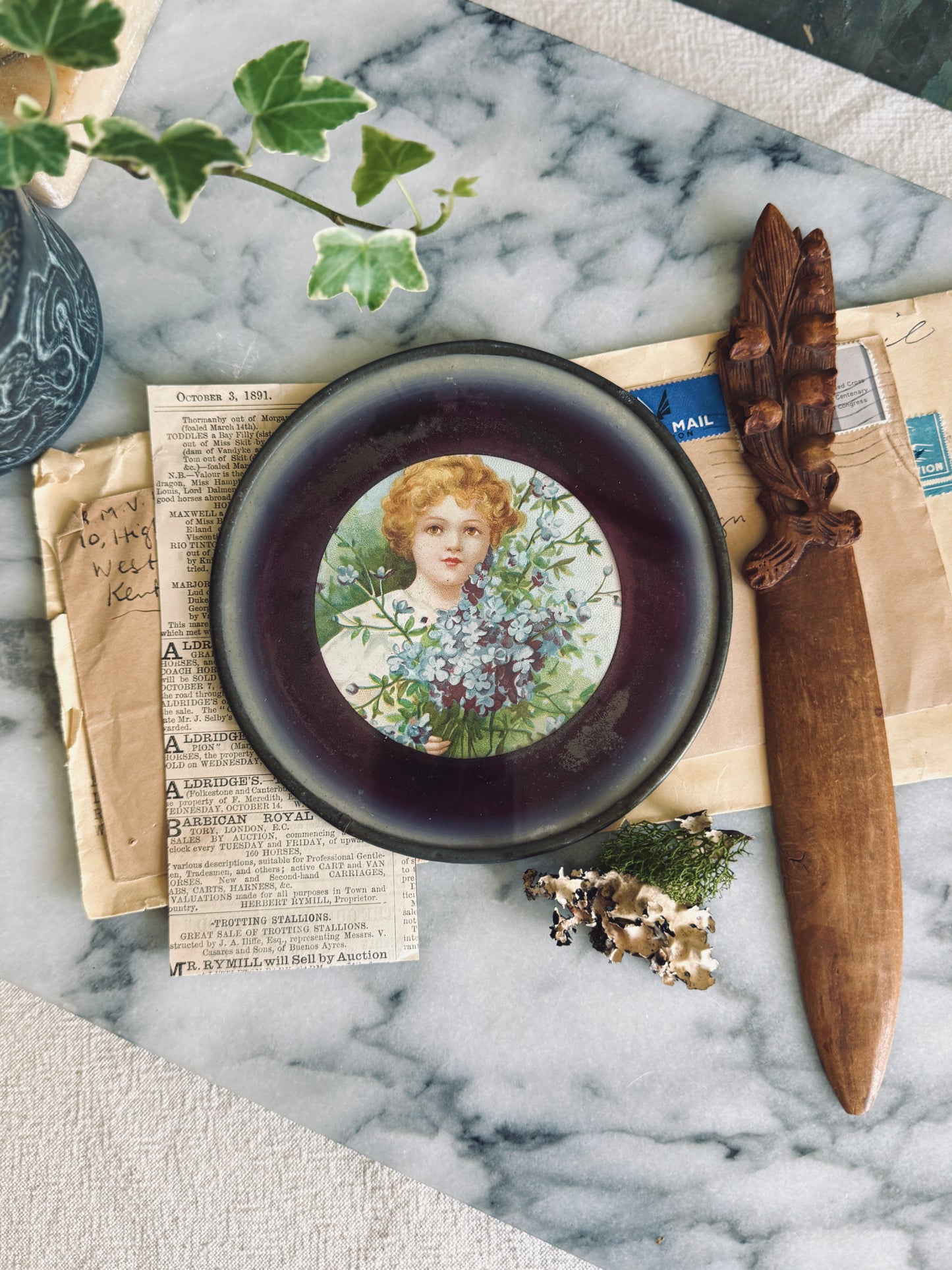 Small antique flue cover with portrait of a girl