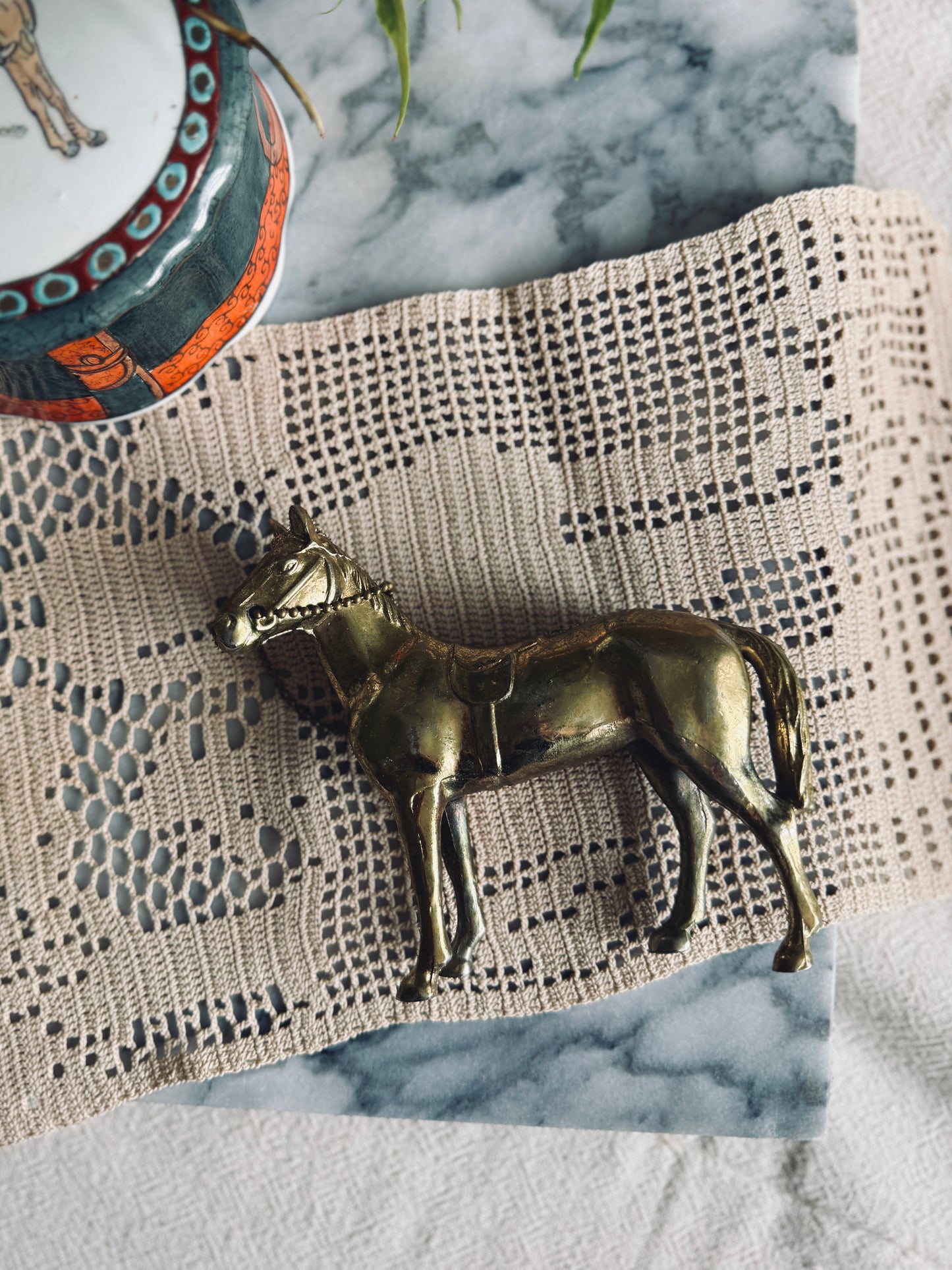 Cast metal horse figurine in gold tone