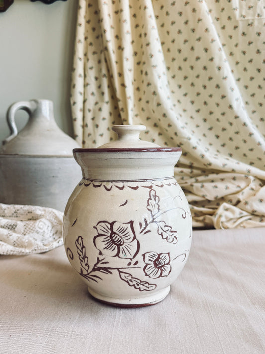 Pottery cookie jar with floral design