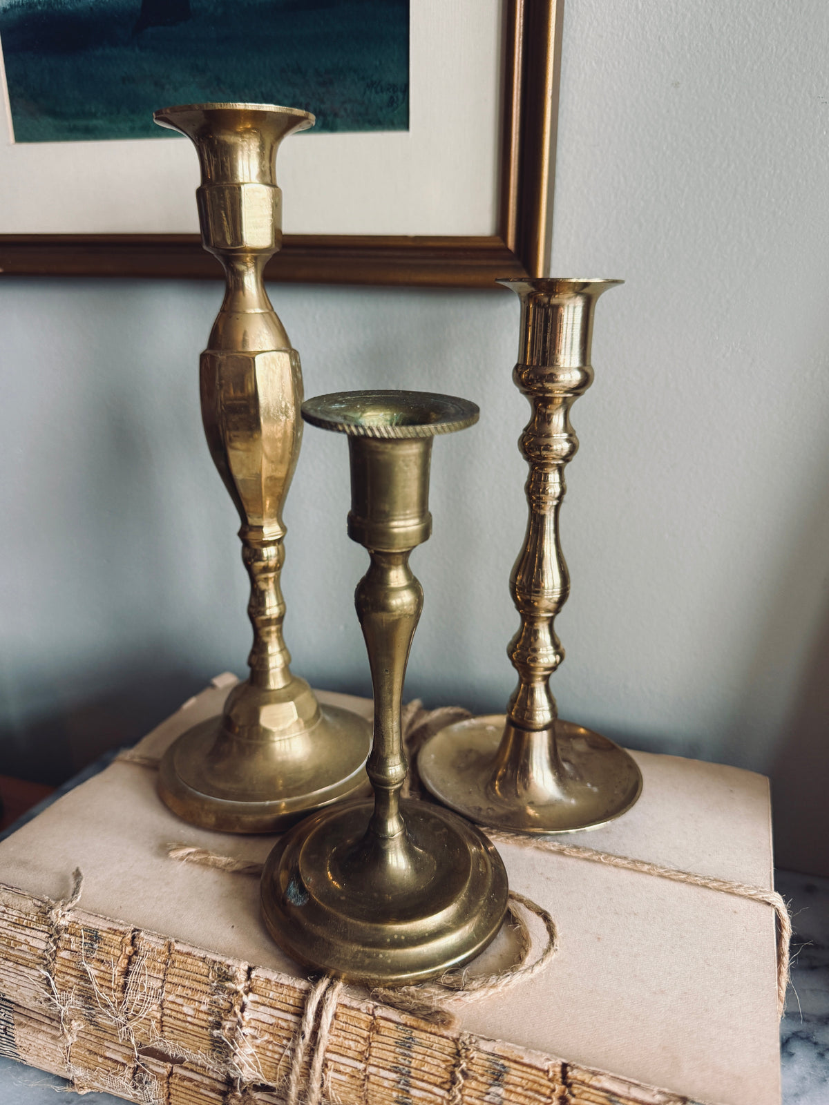 Instant collection of three vintage solid brass candlesticks