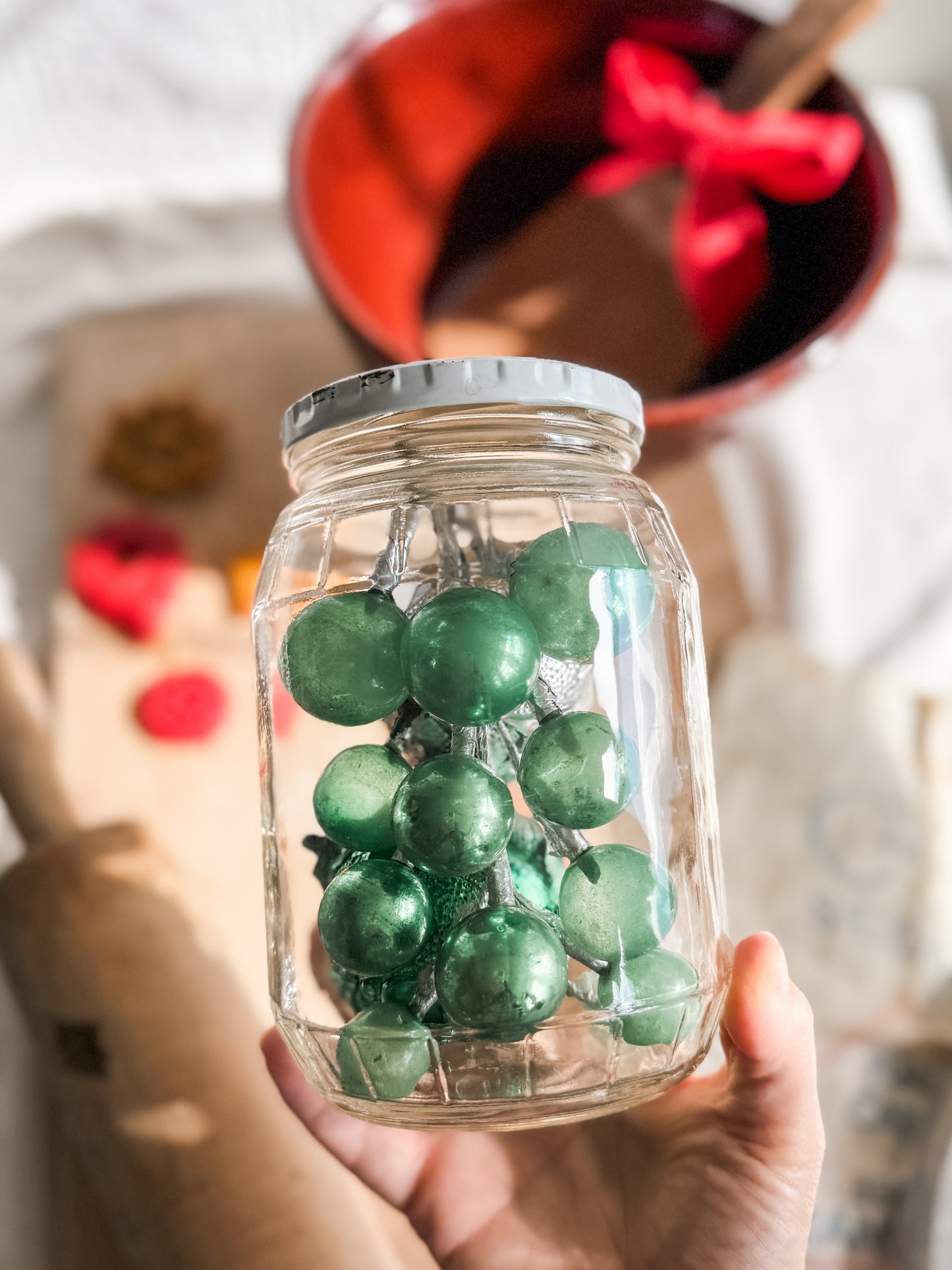 Vintage glass lidded jar with green ornaments