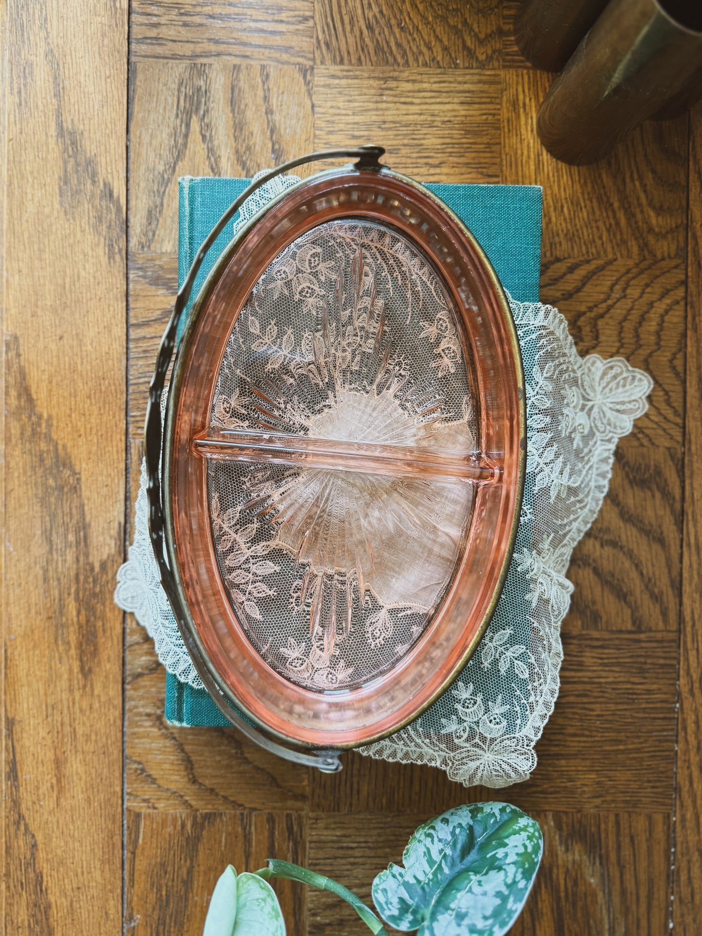 Divided pink depression glass in handled carrier