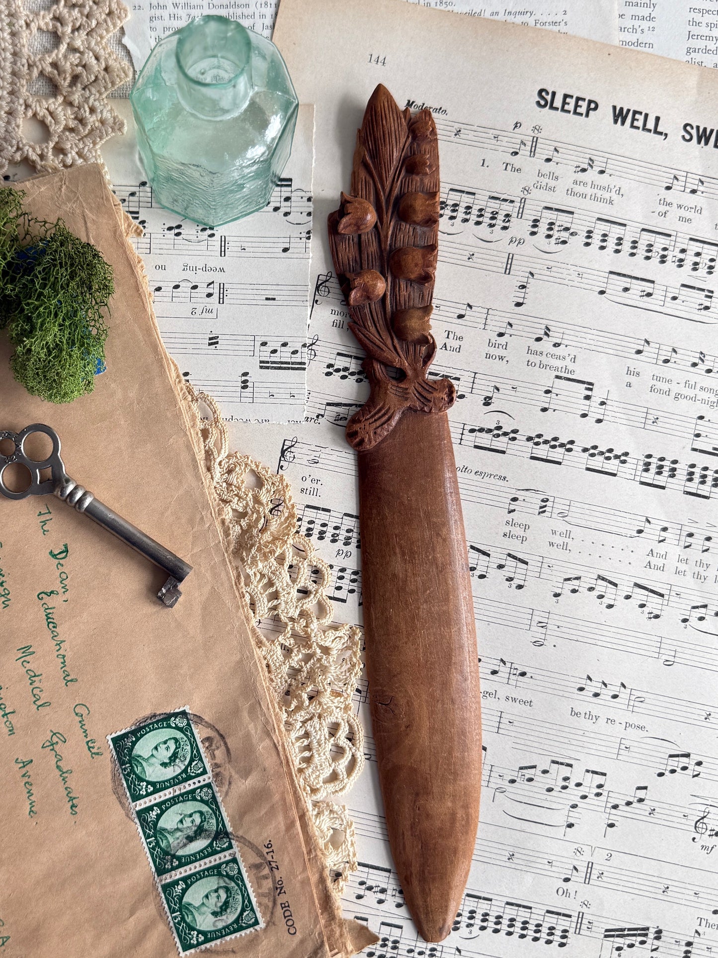 Hand carved wooden letter opener with floral handle