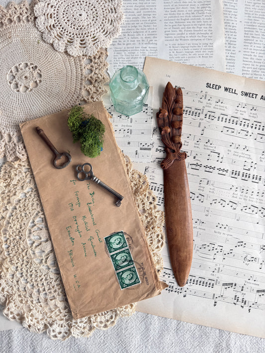 Hand carved wooden letter opener with floral handle