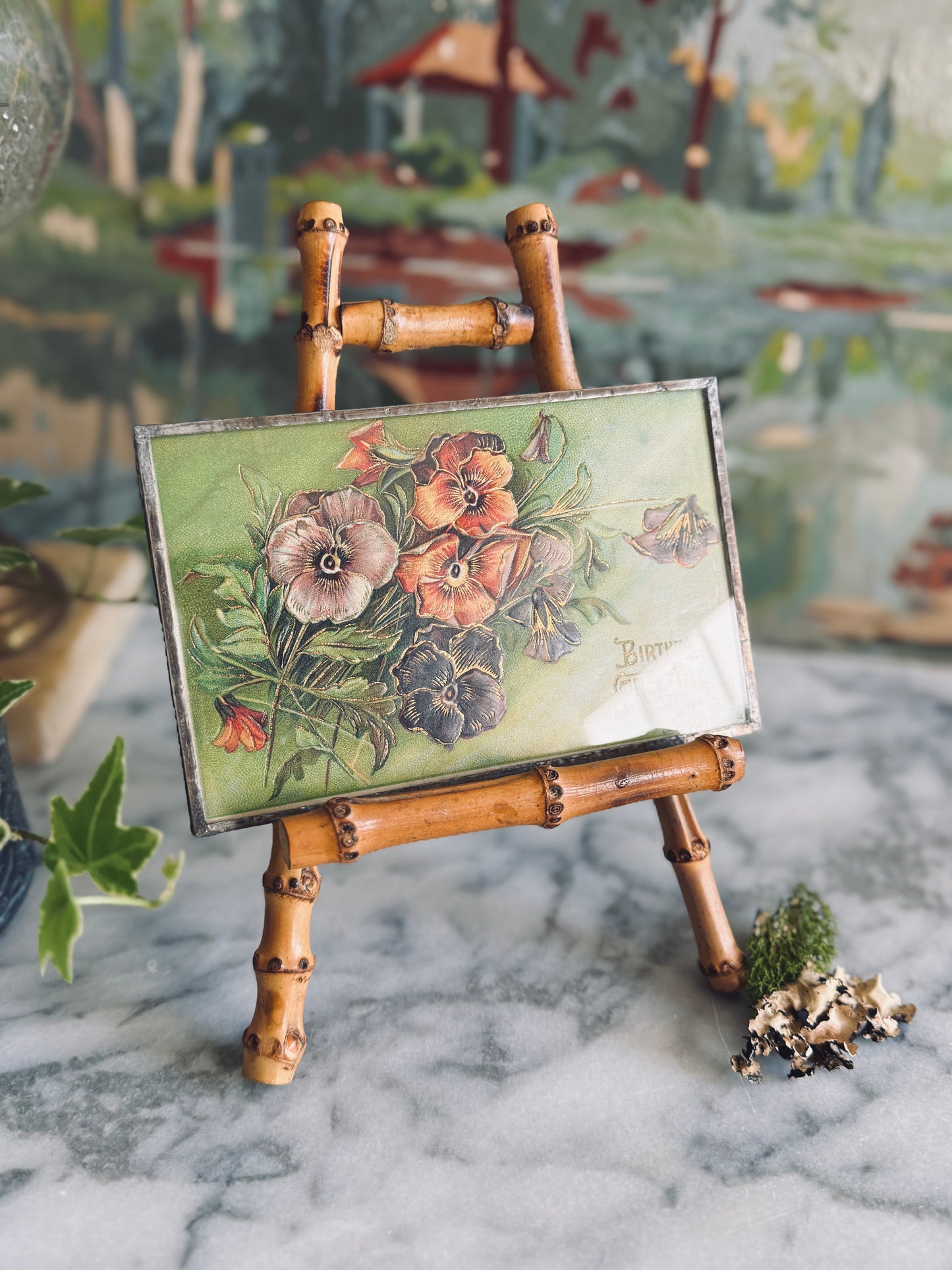 Antique postcard framed between glass