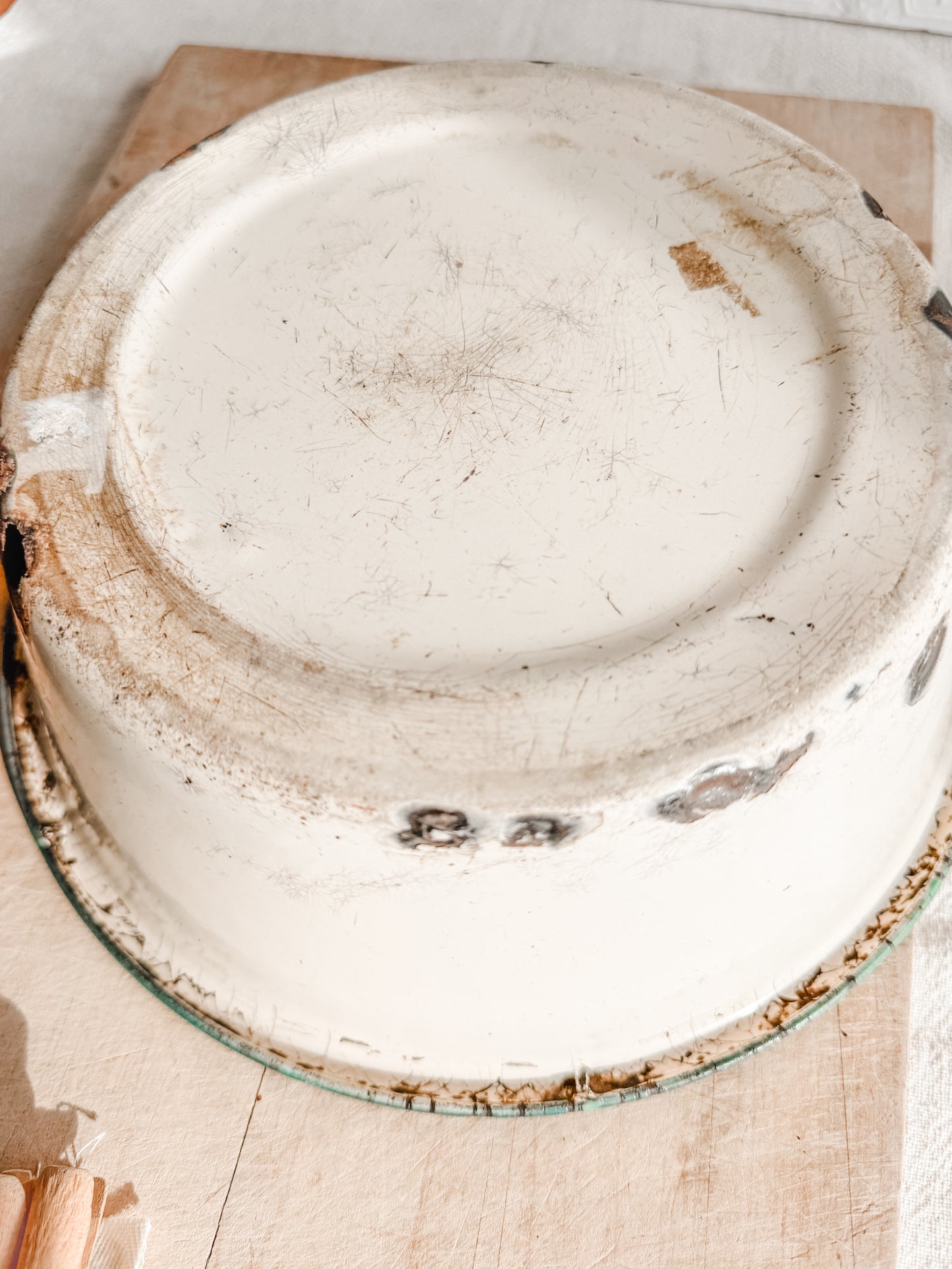 Medium Green Rimmed Tan Rusty and Chippy Enamelware dish