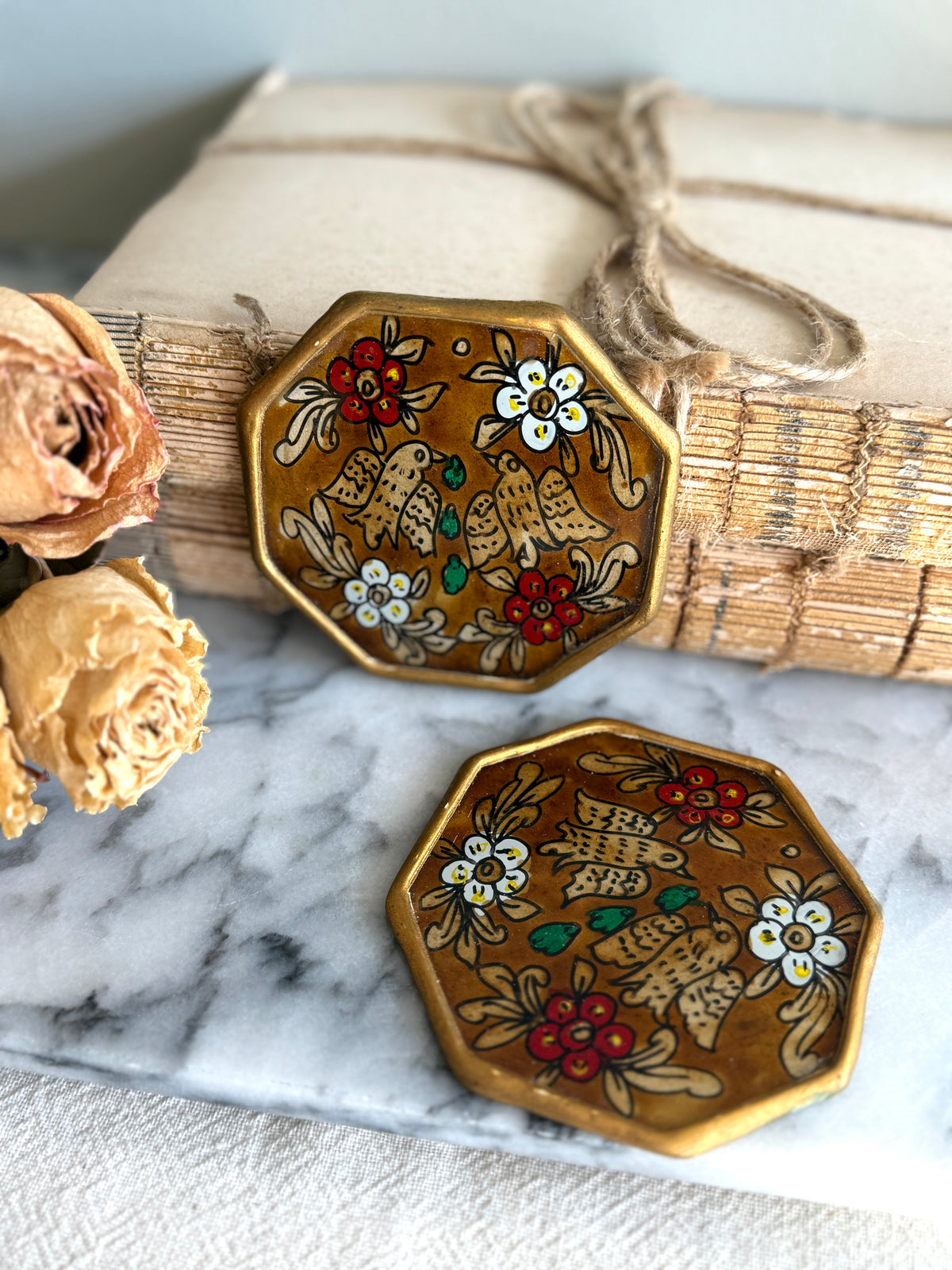 Pair of reverse painted coasters