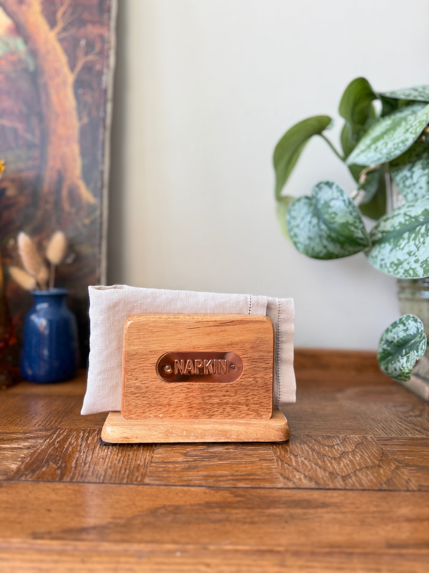 Wooden napkin holder with copper plate