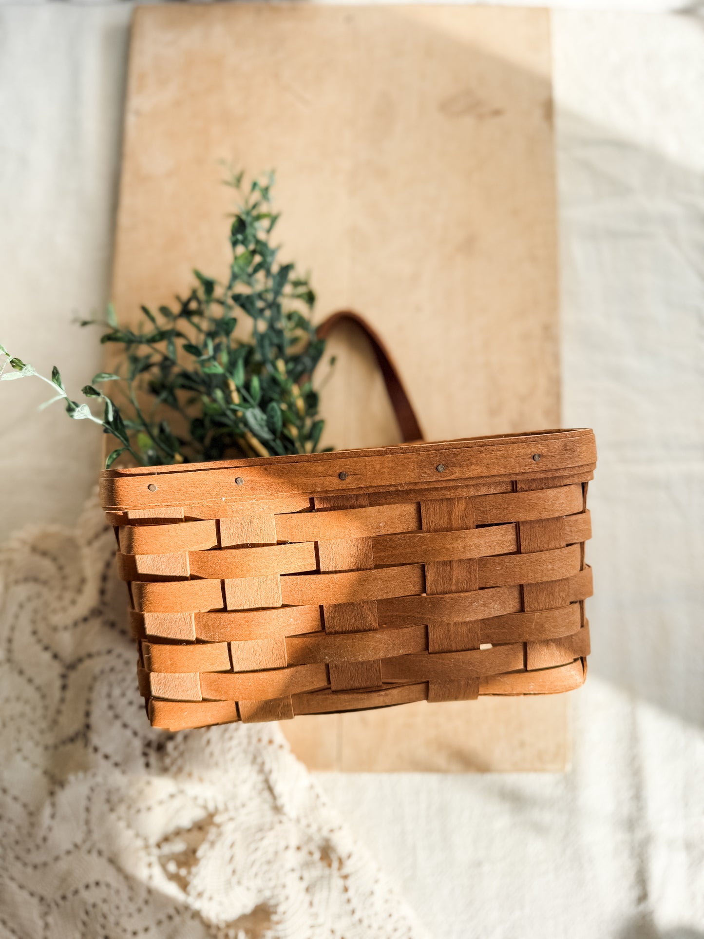 Medium vintage Longaberger woven basket with leather handle and wall hanger