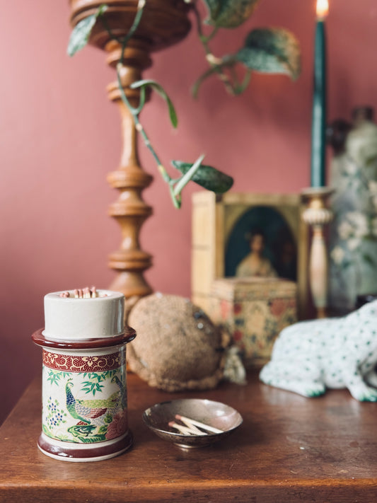 Porcelain candle holder with peacock