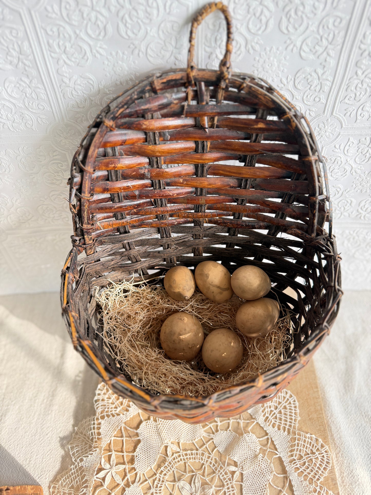 Wicker hanging nesting basket with gourd eggs