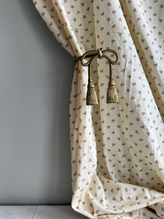 Pair of brass bow curtain tie backs