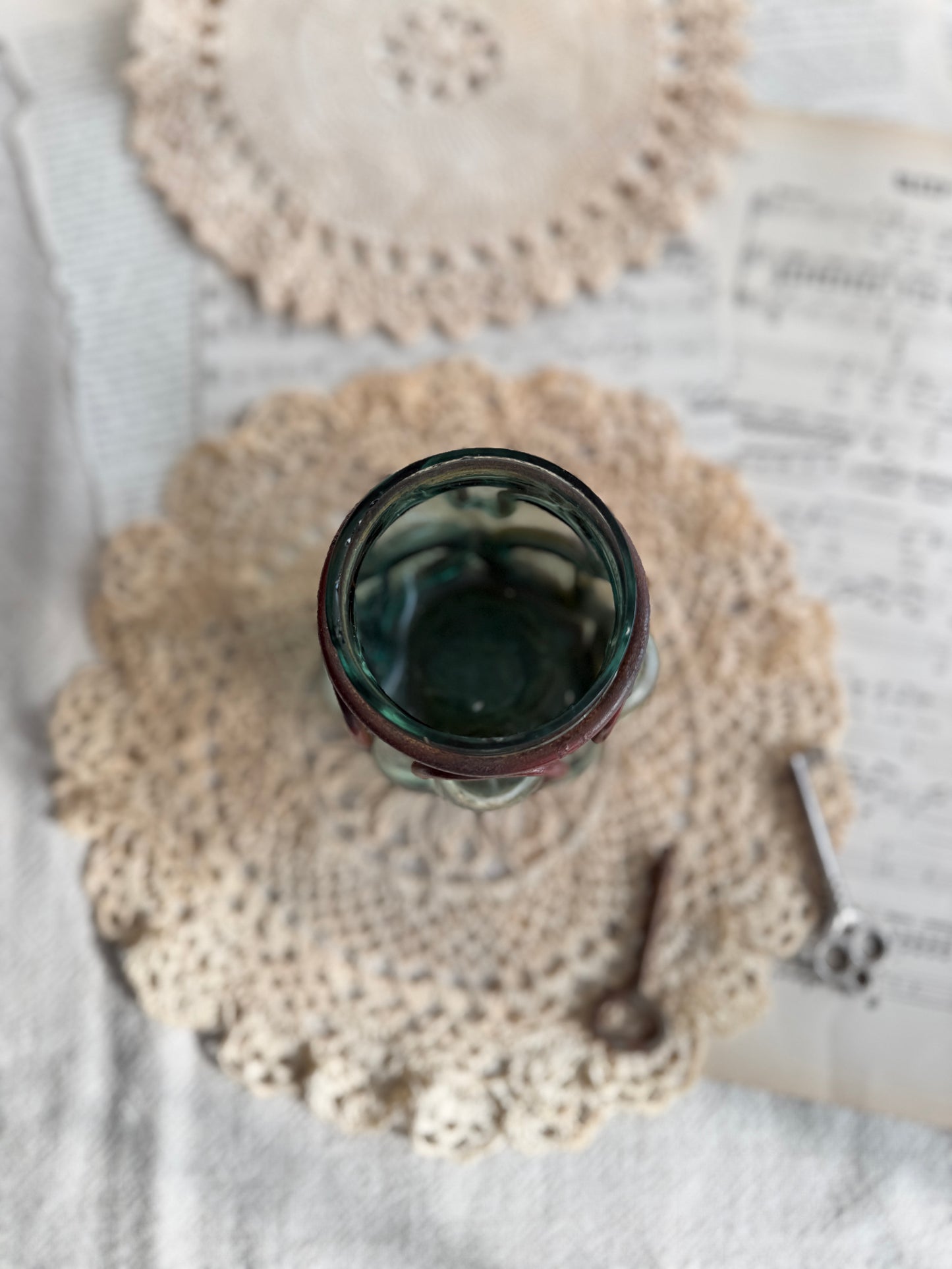 Caged glass candle holder