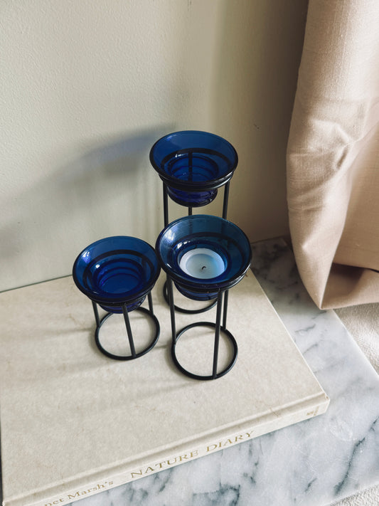 Metal and cobalt blue glass tealight holders