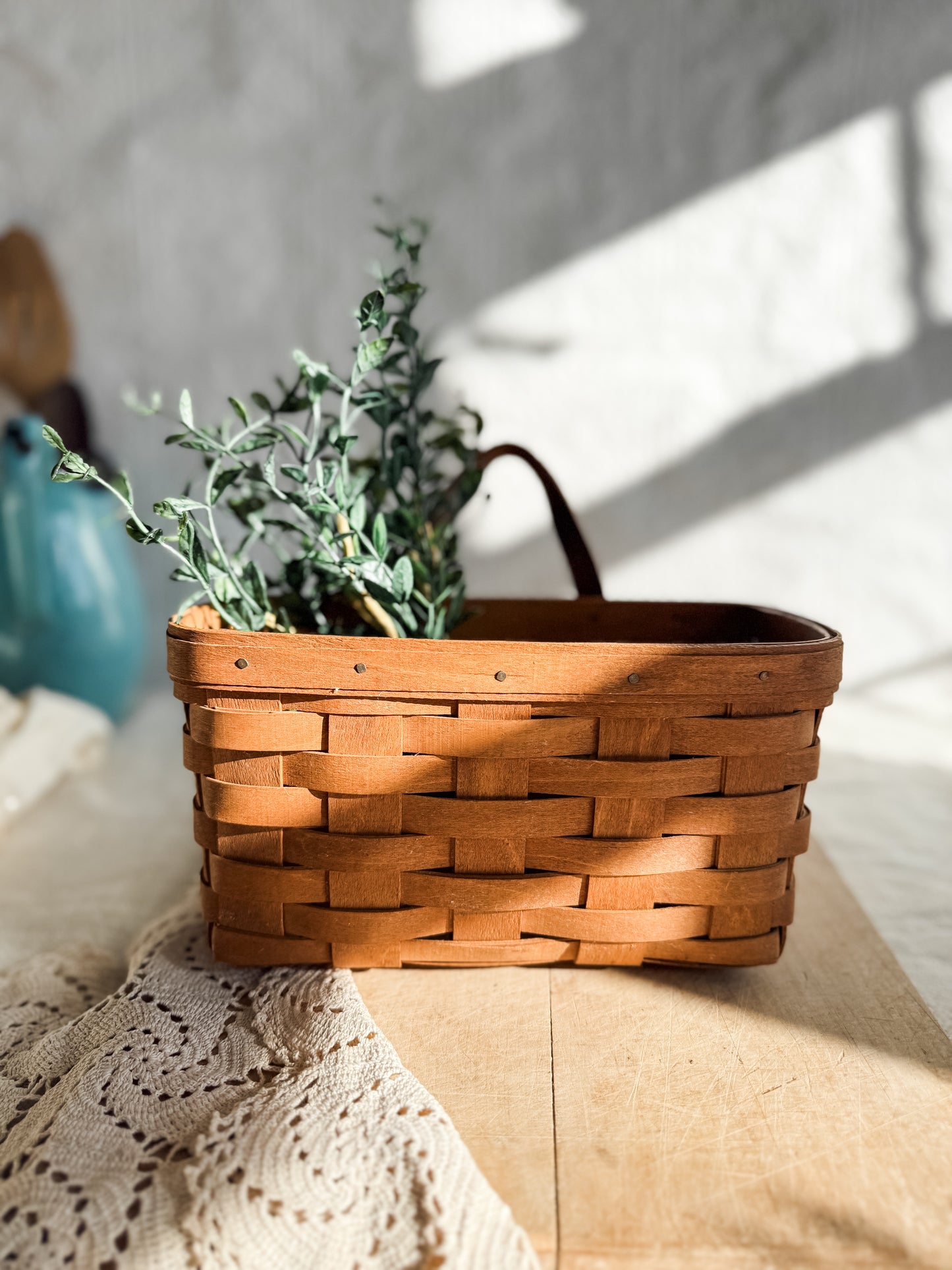 Medium vintage Longaberger woven basket with leather handle and wall hanger