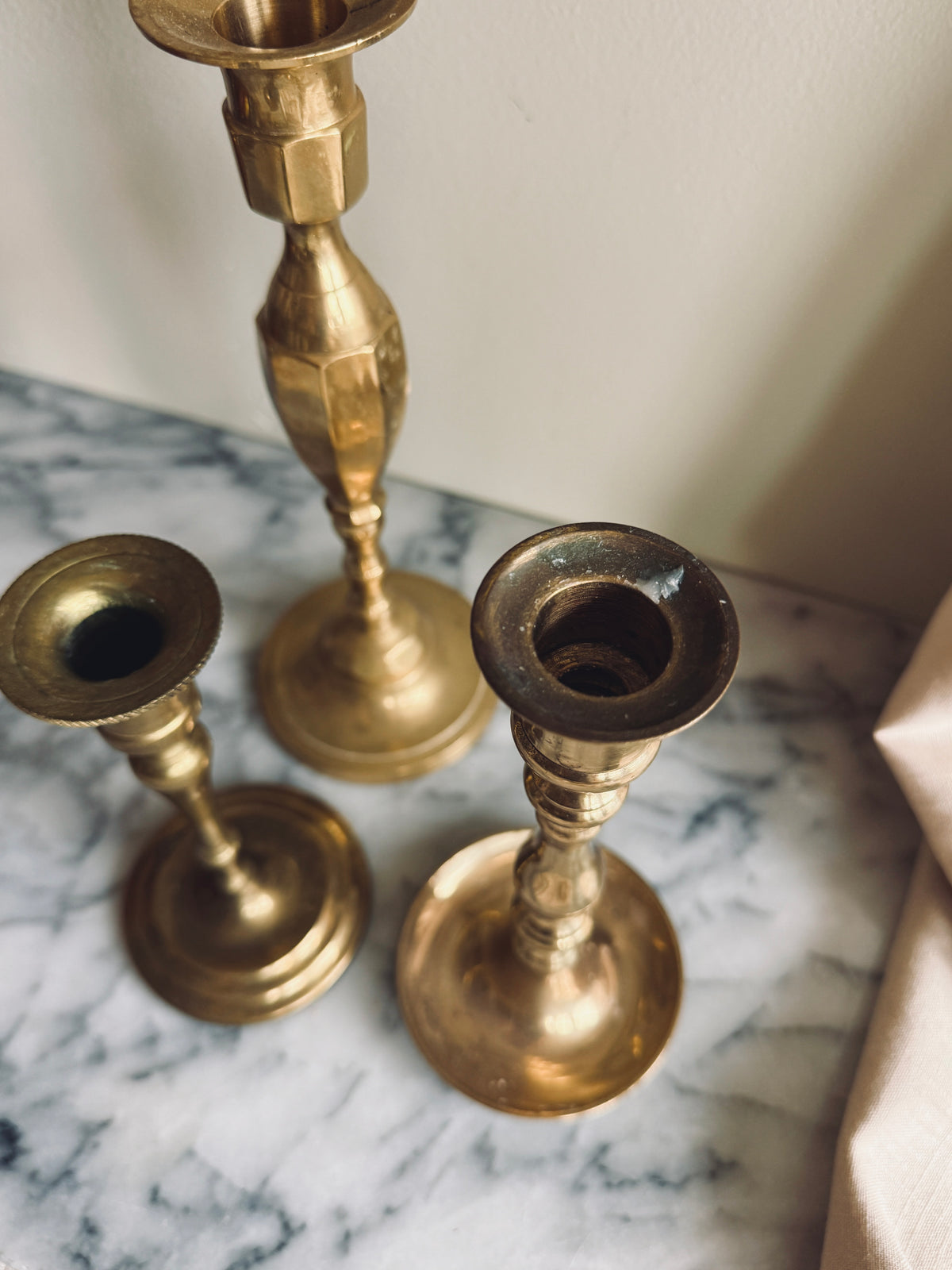 Instant collection of three vintage solid brass candlesticks